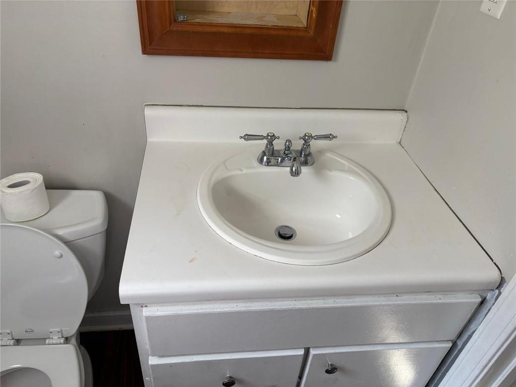 3483 Lawton Road Macon, GA 31204 - Photo 9 of 15 a bathroom with a sink and a toilet