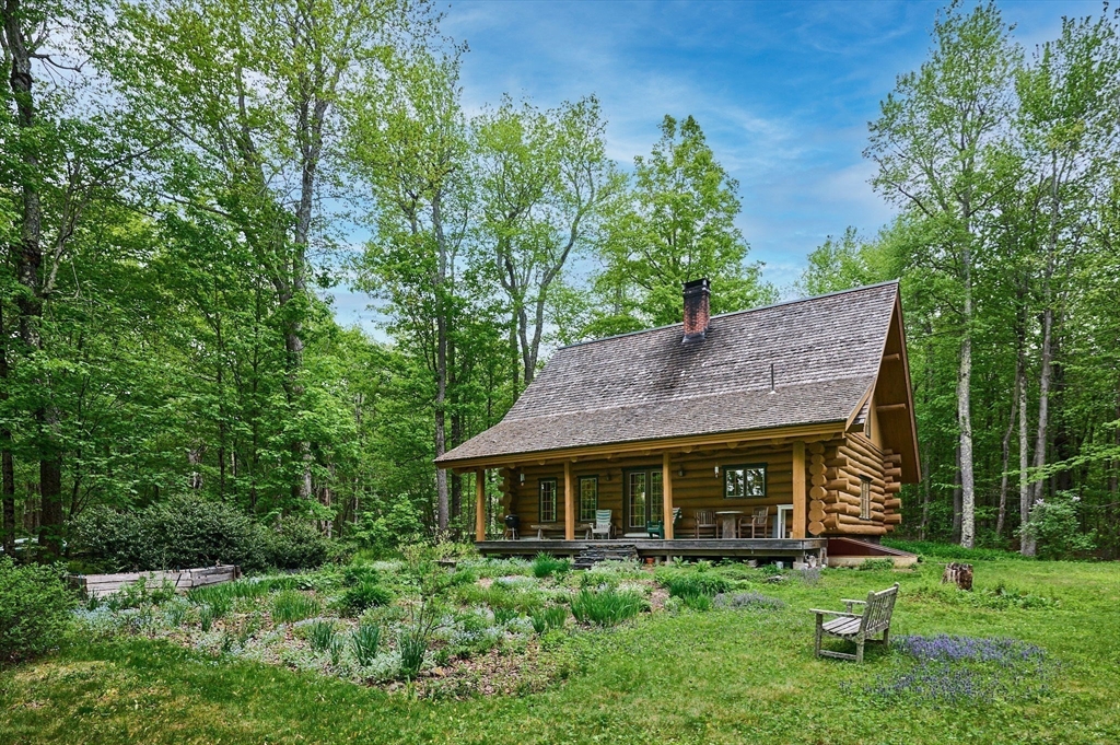 486 Old Stage Road Ashfield, MA 01330 - Photo 24 of 36 a front view of a house with a yard