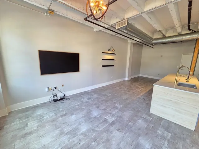 a view of a livingroom with wooden floor