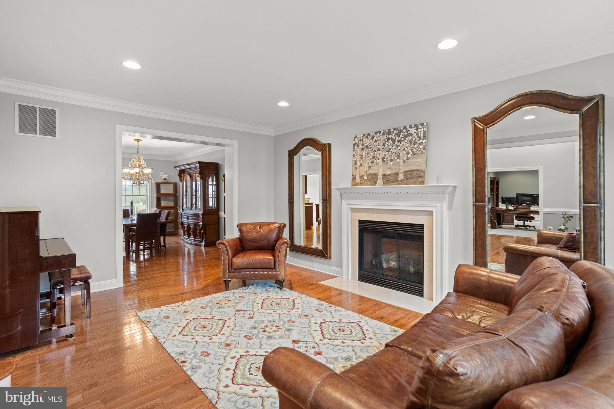 1368 Spring Hill Road Eagleville, PA 19403 - Photo 13 of 66 a living room with furniture and a fireplace