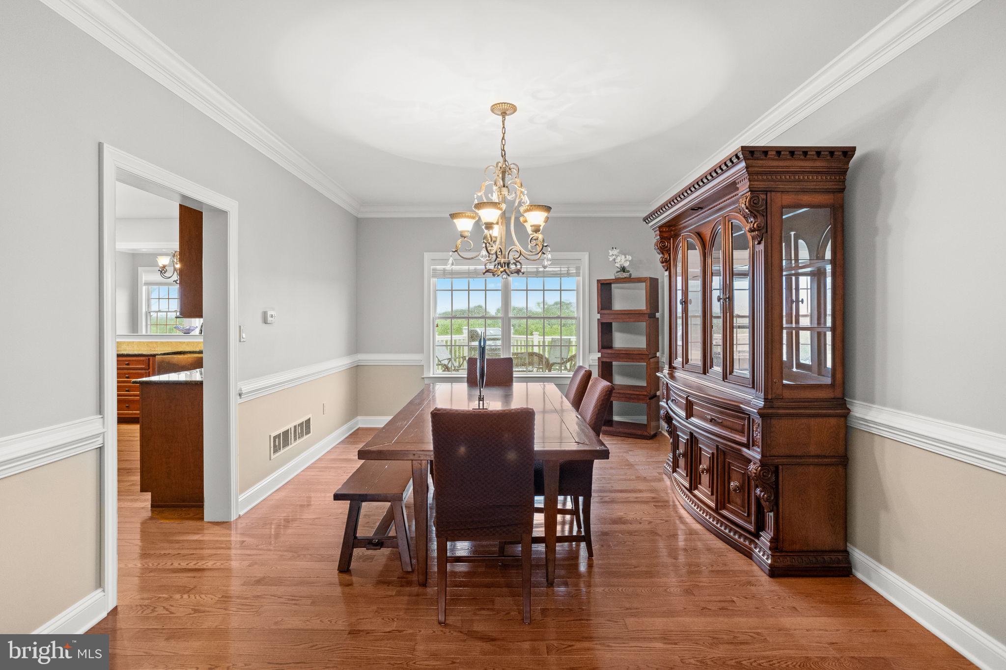 1368 Spring Hill Road Eagleville, PA 19403 - Photo 16 of 66 a view of a dining room with furniture window and wooden floor