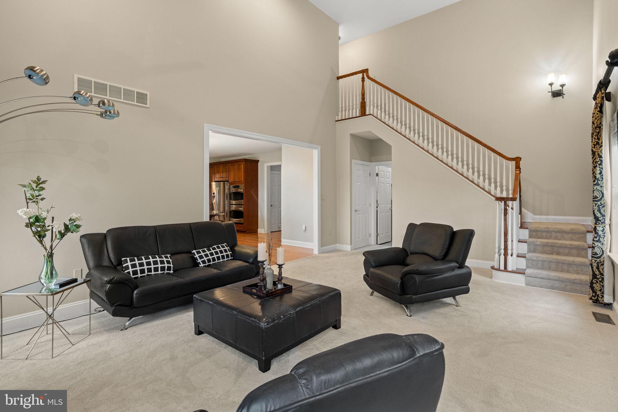 1368 Spring Hill Road Eagleville, PA 19403 - Photo 19 of 66 a living room with furniture and a wooden floor