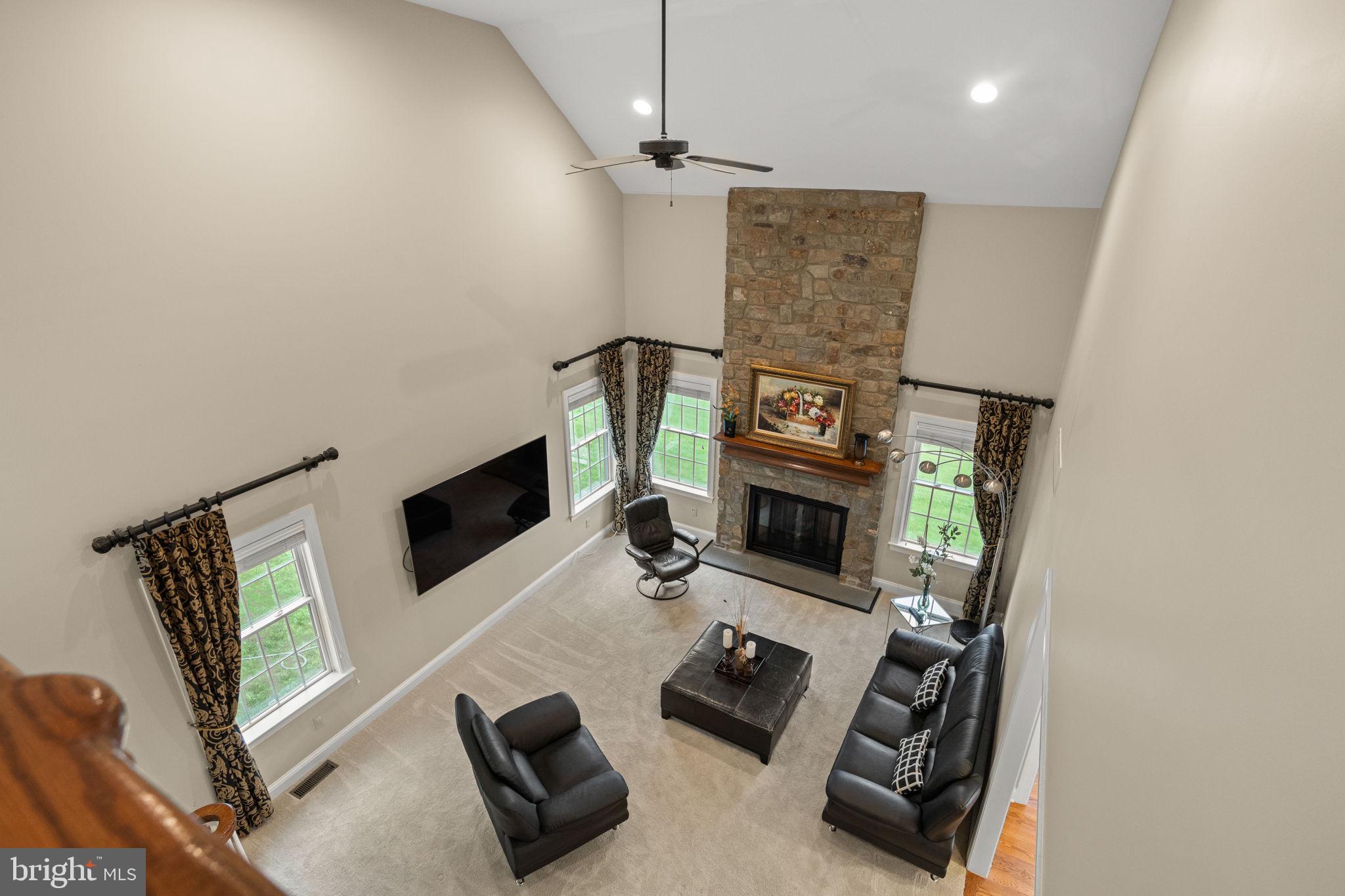1368 Spring Hill Road Eagleville, PA 19403 - Photo 20 of 66 a living room with furniture and a flat screen tv