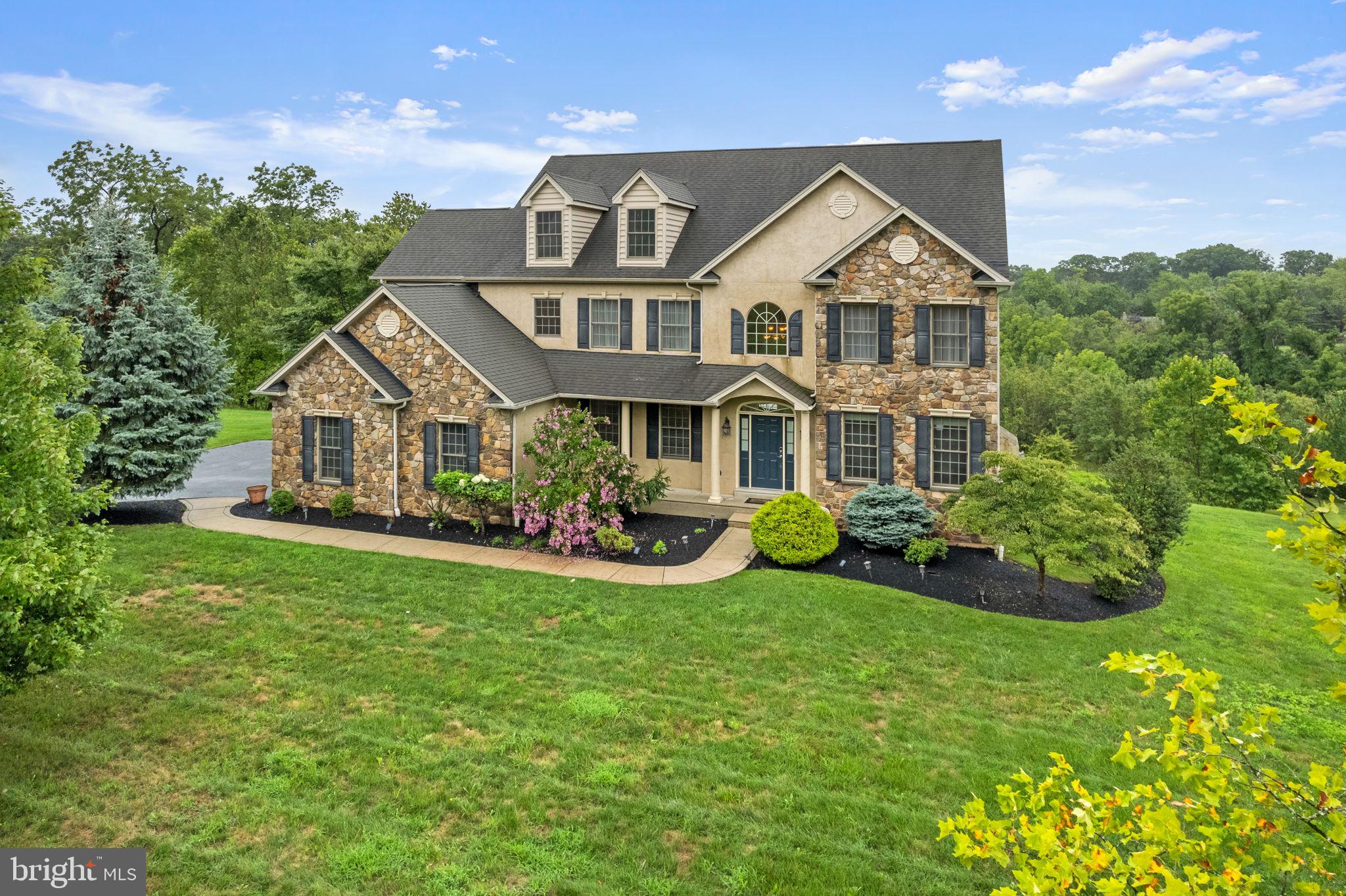 1368 Spring Hill Road Eagleville, PA 19403 - Photo 2 of 66 a view of a house with garden and yard