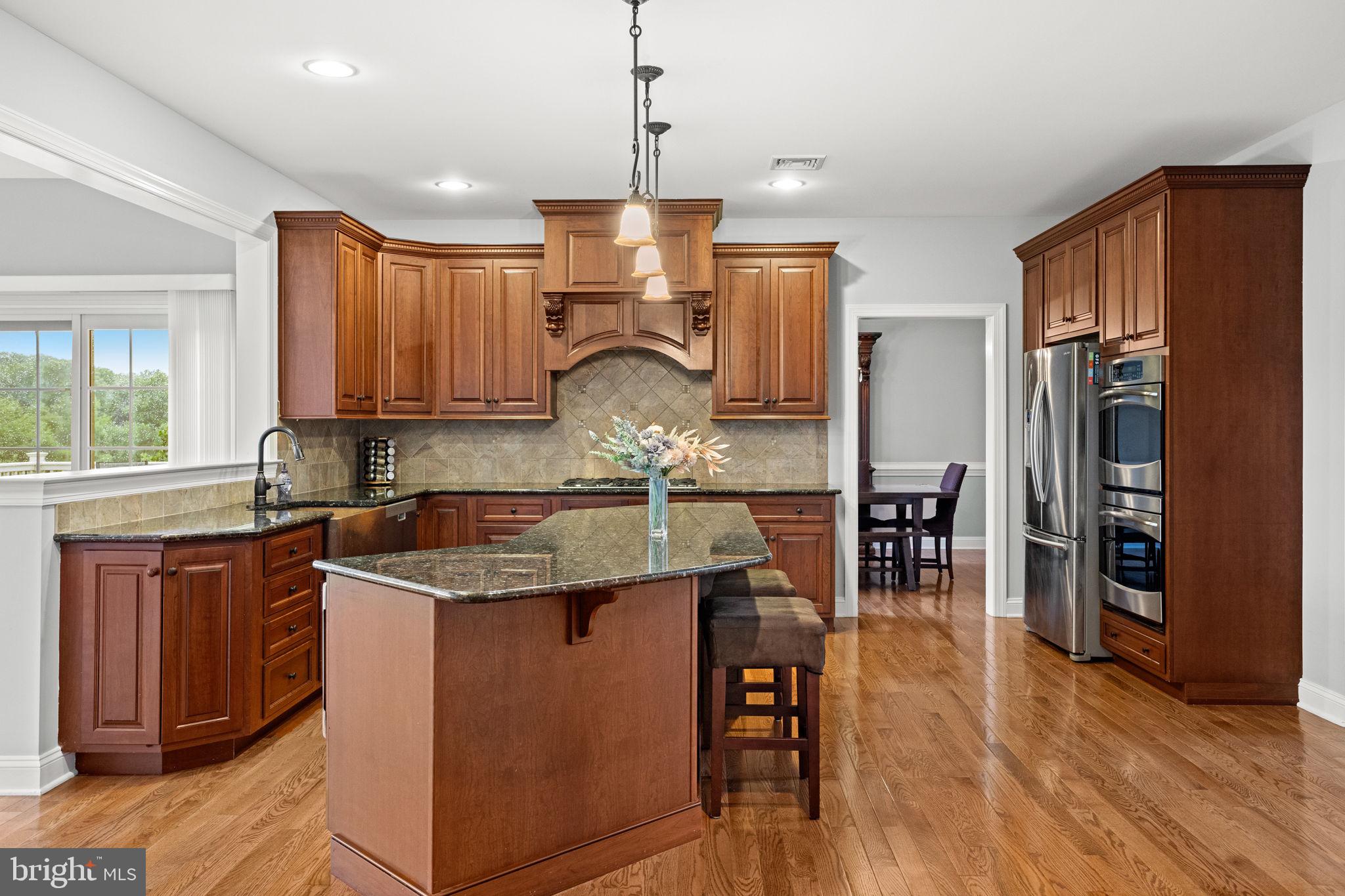 1368 Spring Hill Road Eagleville, PA 19403 - Photo 22 of 66 a kitchen with stainless steel appliances granite countertop a sink refrigerator and cabinets