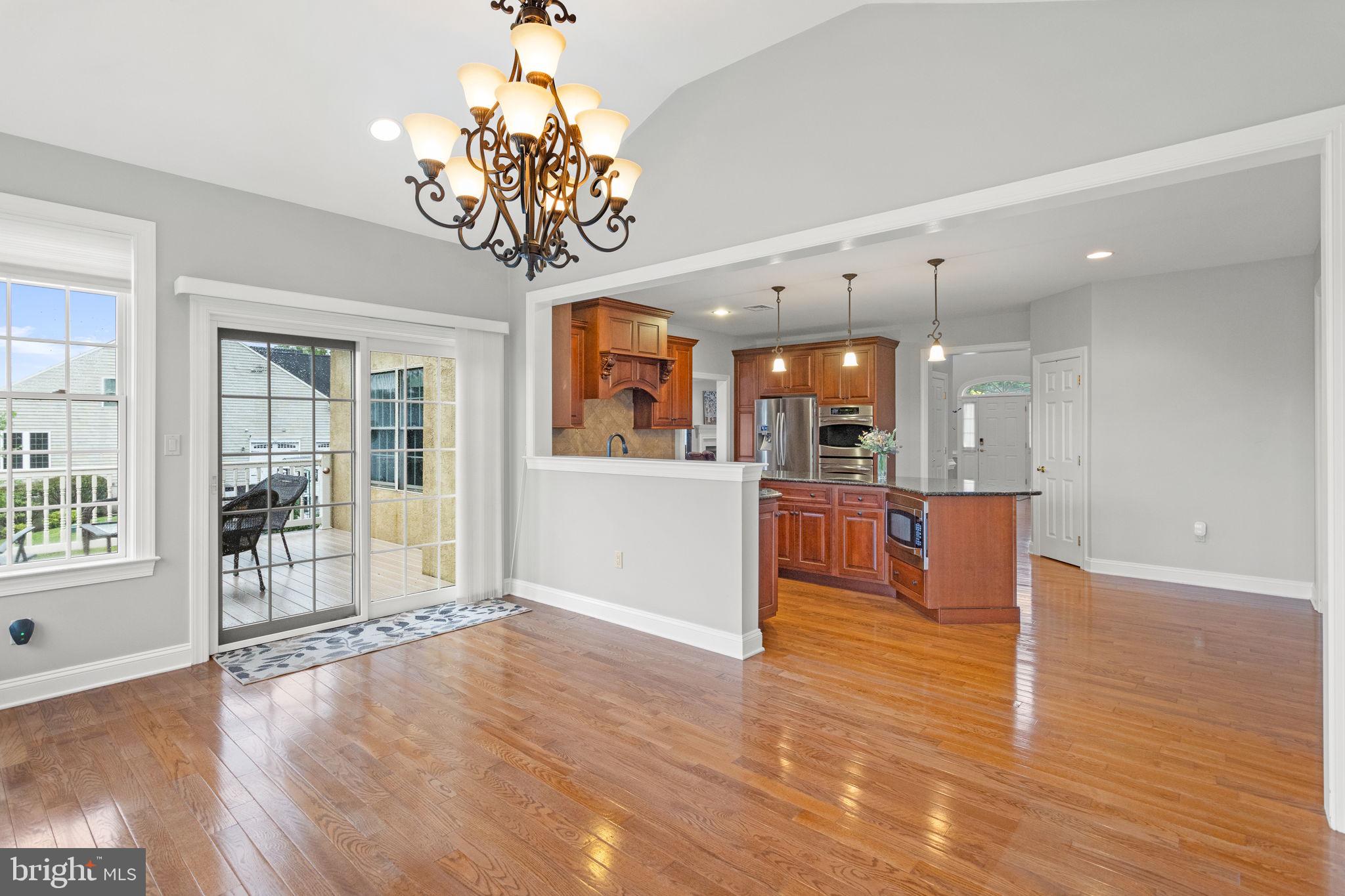 1368 Spring Hill Road Eagleville, PA 19403 - Photo 26 of 66 a view of a lobby with furniture and a kitchen