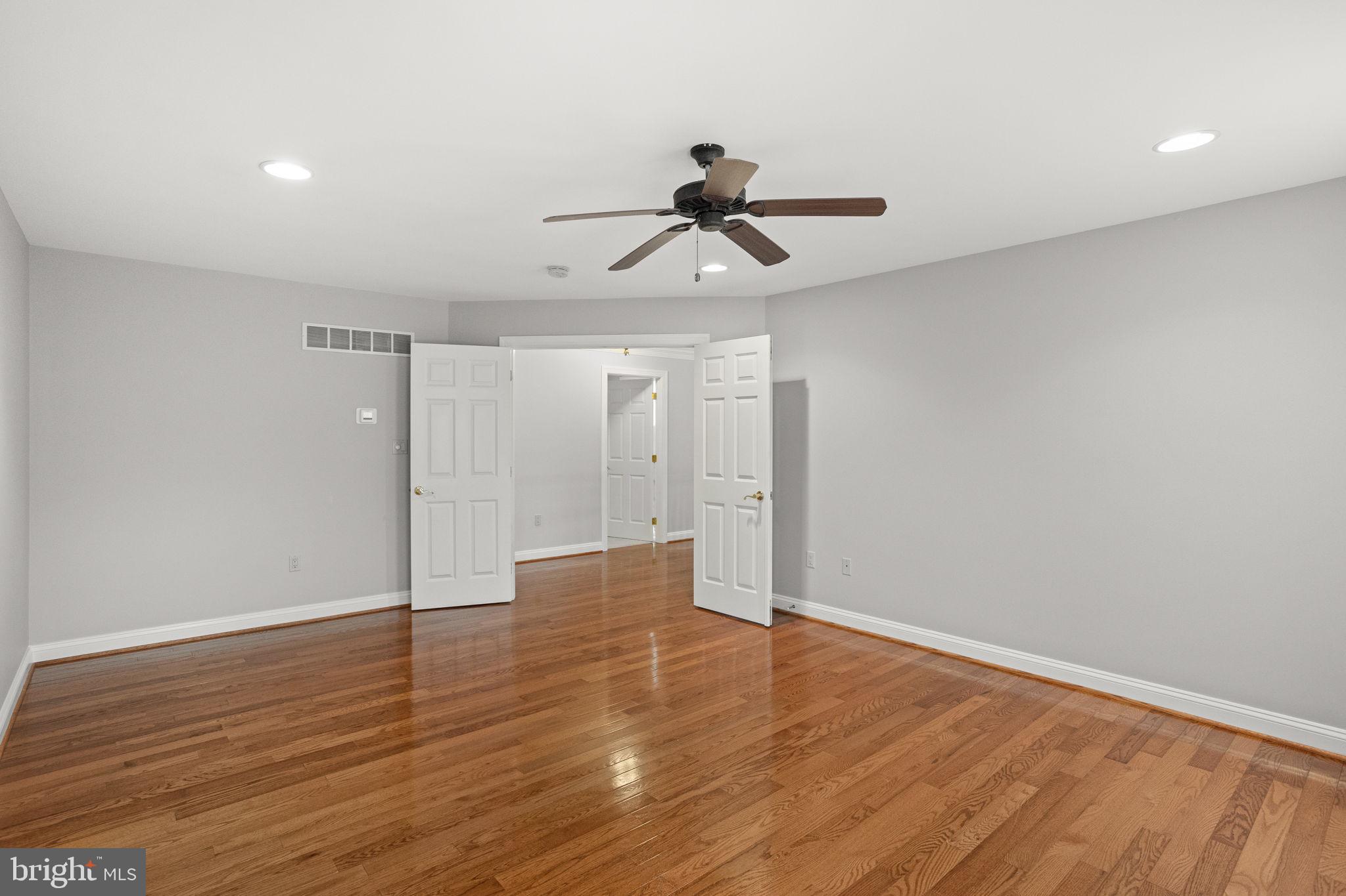 1368 Spring Hill Road Eagleville, PA 19403 - Photo 32 of 66 wooden floor in an empty room with a window