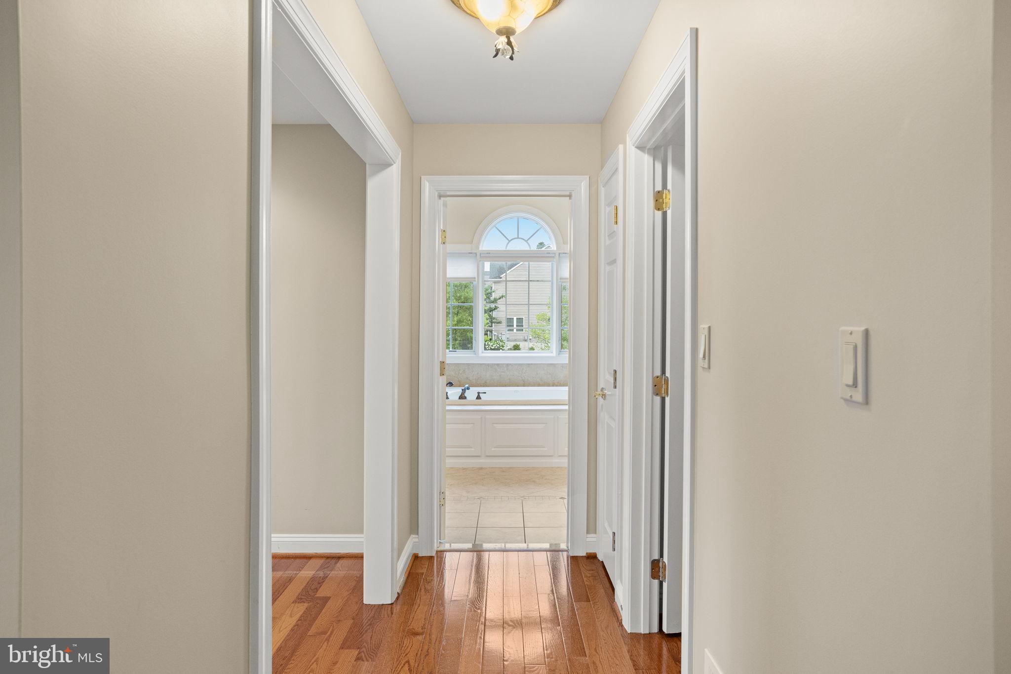1368 Spring Hill Road Eagleville, PA 19403 - Photo 35 of 66 a view of a hallway with wooden floor and front door