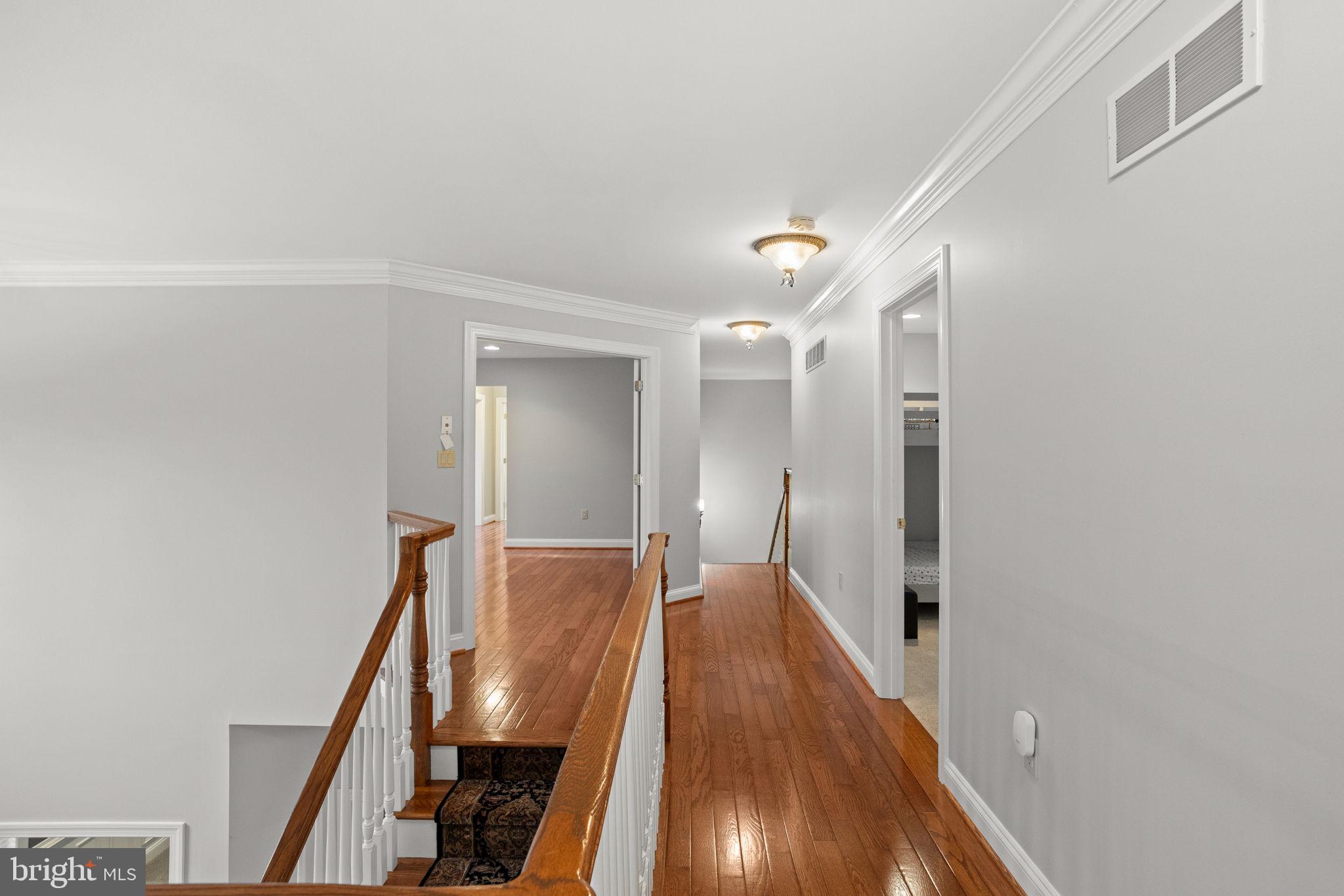 1368 Spring Hill Road Eagleville, PA 19403 - Photo 39 of 66 a view of a hallway with wooden floor
