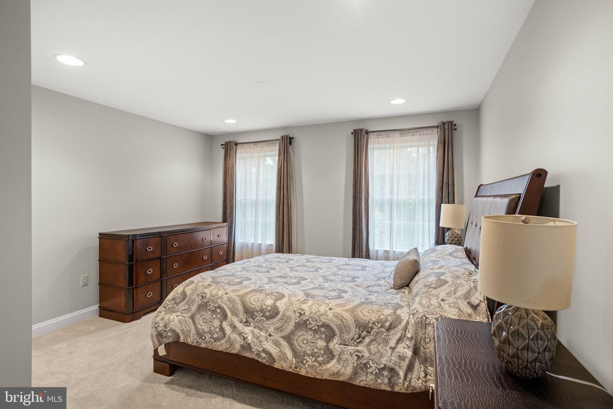1368 Spring Hill Road Eagleville, PA 19403 - Photo 40 of 66 a bedroom with a large bed and a window