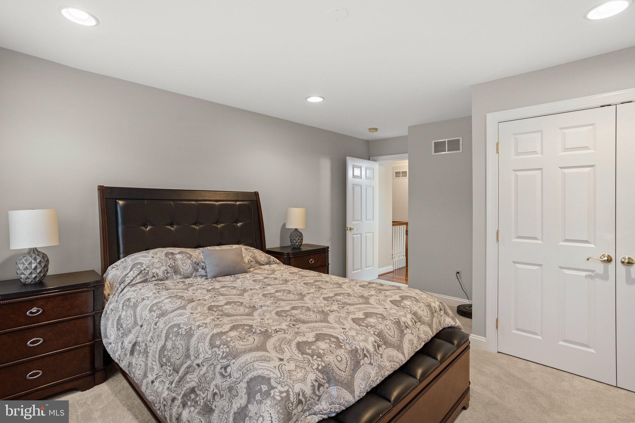 1368 Spring Hill Road Eagleville, PA 19403 - Photo 41 of 66 a bedroom with a bed and a lamp