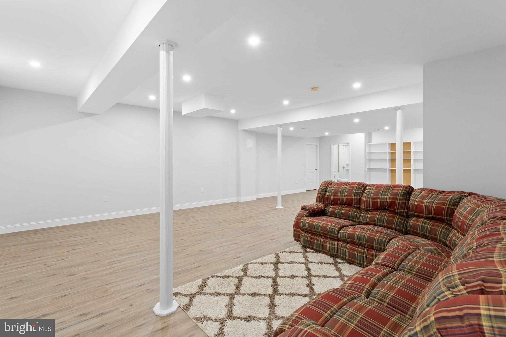 1368 Spring Hill Road Eagleville, PA 19403 - Photo 49 of 66 a living room with furniture and a wooden floor