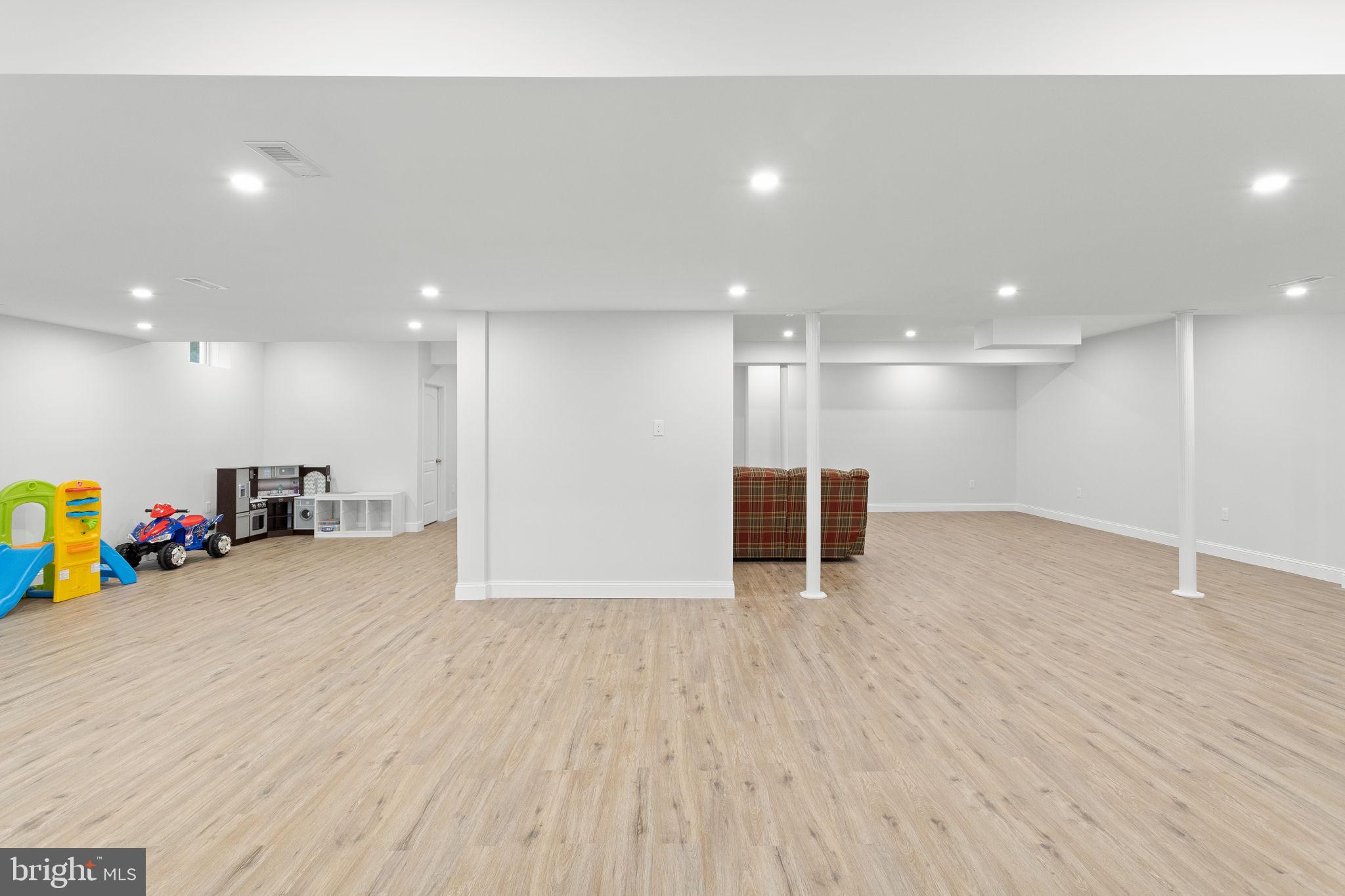1368 Spring Hill Road Eagleville, PA 19403 - Photo 50 of 66 a view of an empty room with wooden floor