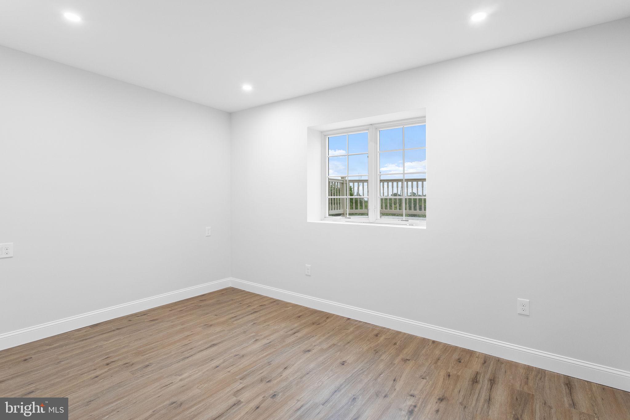 1368 Spring Hill Road Eagleville, PA 19403 - Photo 52 of 66 a view of a room with wooden floor and windows