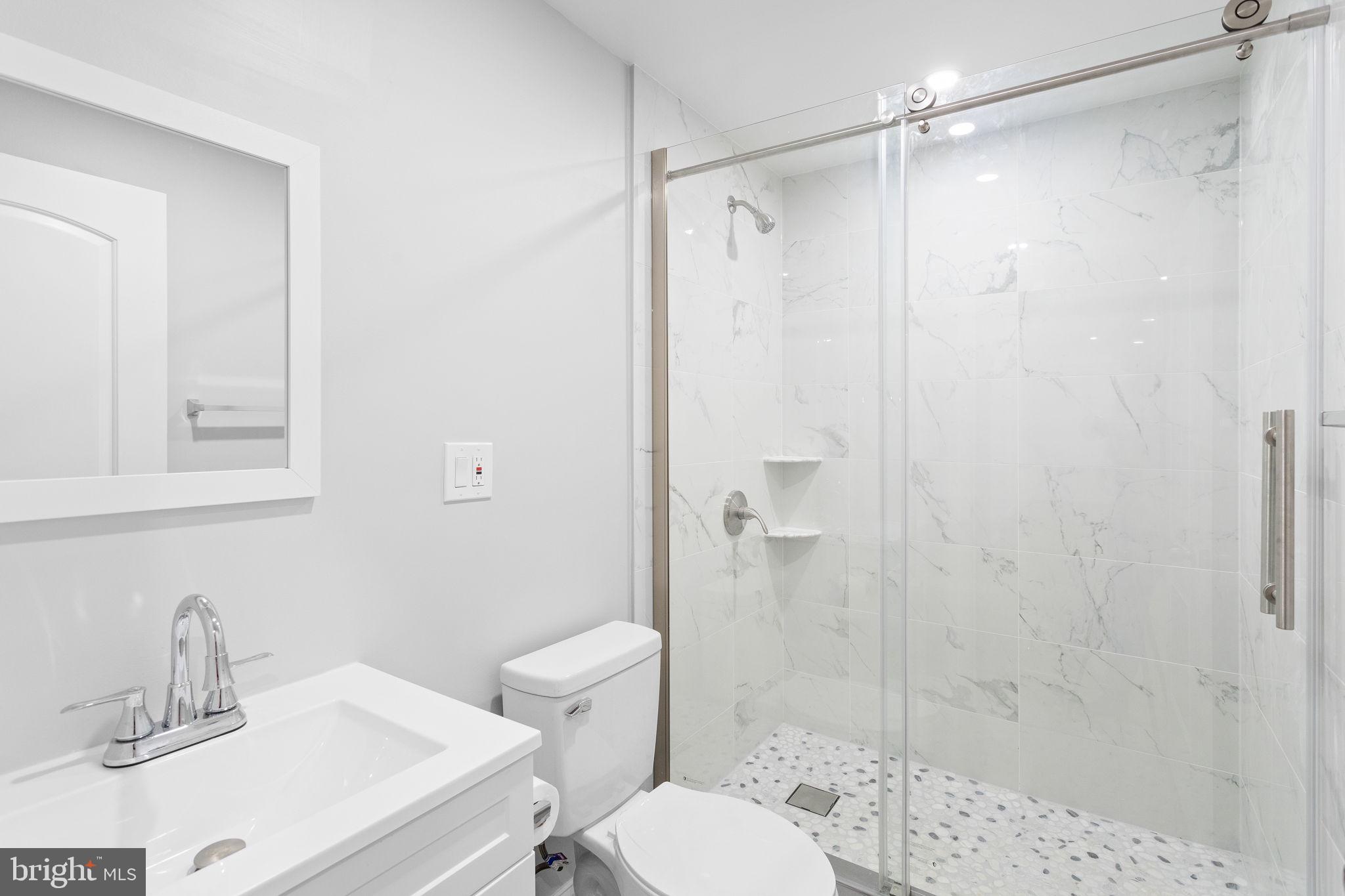 1368 Spring Hill Road Eagleville, PA 19403 - Photo 55 of 66 a bathroom with a sink toilet and shower