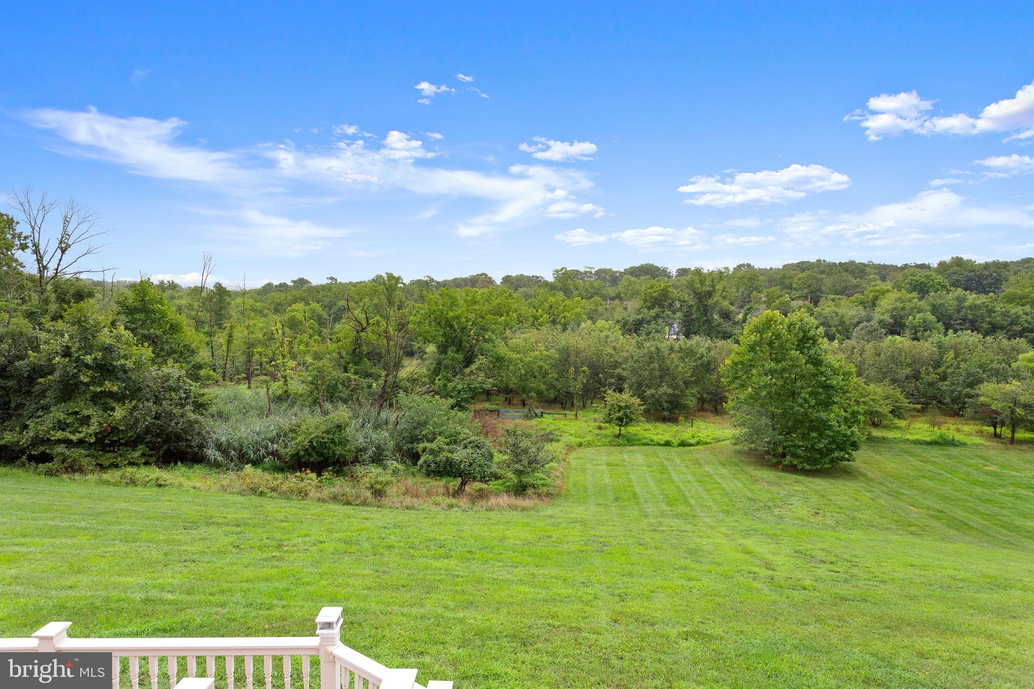 1368 Spring Hill Road Eagleville, PA 19403 - Photo 62 of 66 a view of a city with lush green forest