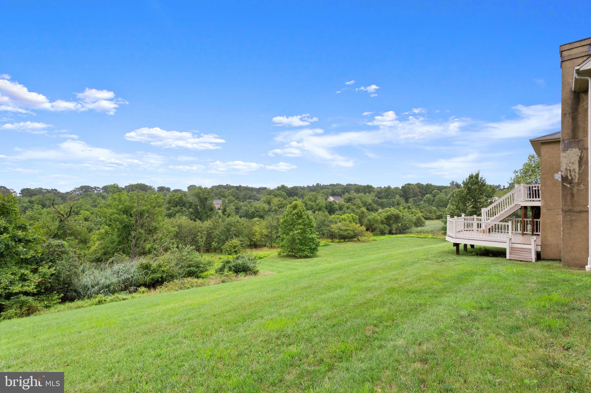 1368 Spring Hill Road Eagleville, PA 19403 - Photo 63 of 66 a view of a garden with a house in the background