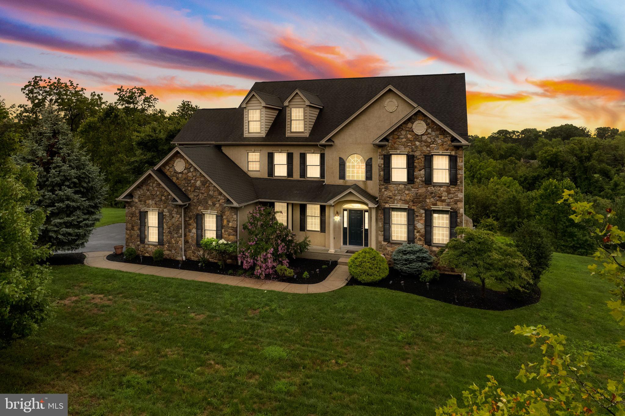 1368 Spring Hill Road Eagleville, PA 19403 - Photo 66 of 66 a front view of a house with a yard