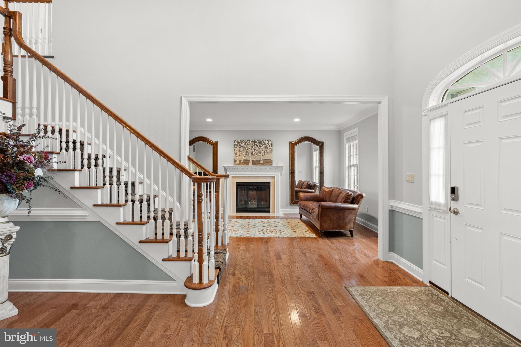 1368 Spring Hill Road Eagleville, PA 19403 - Photo 9 of 66 a living room with fireplace furniture and a wooden floor