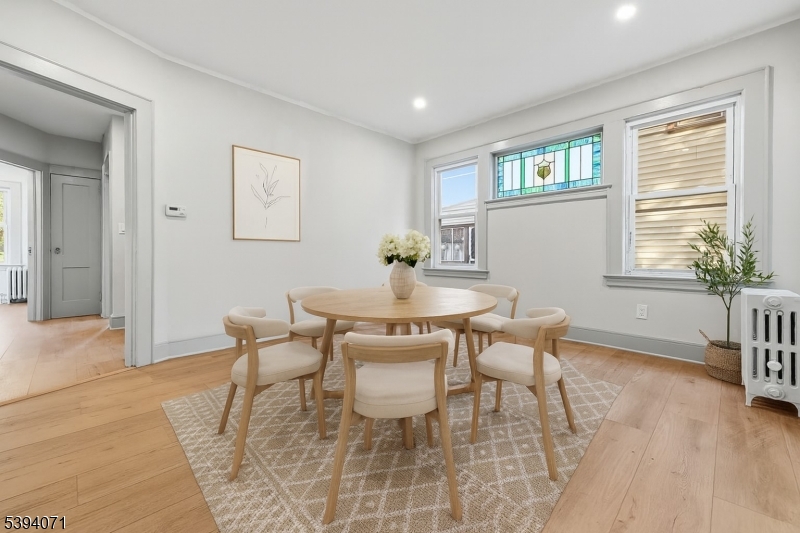 28 State Street, Unit 1 Bloomfield, NJ 07003 - Photo 1 of 8 a dining room with furniture and window