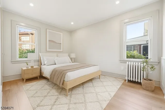 a spacious bedroom with a bed and a window