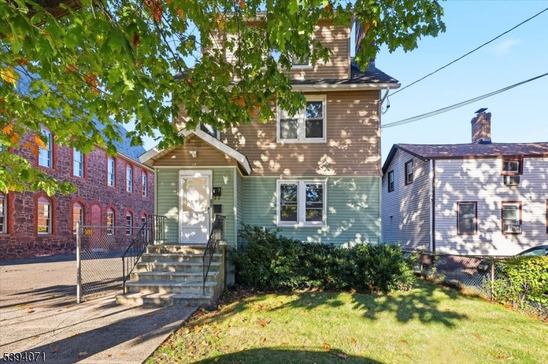 28 State Street, Unit 1 Bloomfield, NJ 07003 - Photo 7 of 8 a front view of a house with a garden