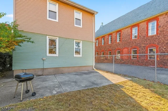 a view of a backyard with a sitting area