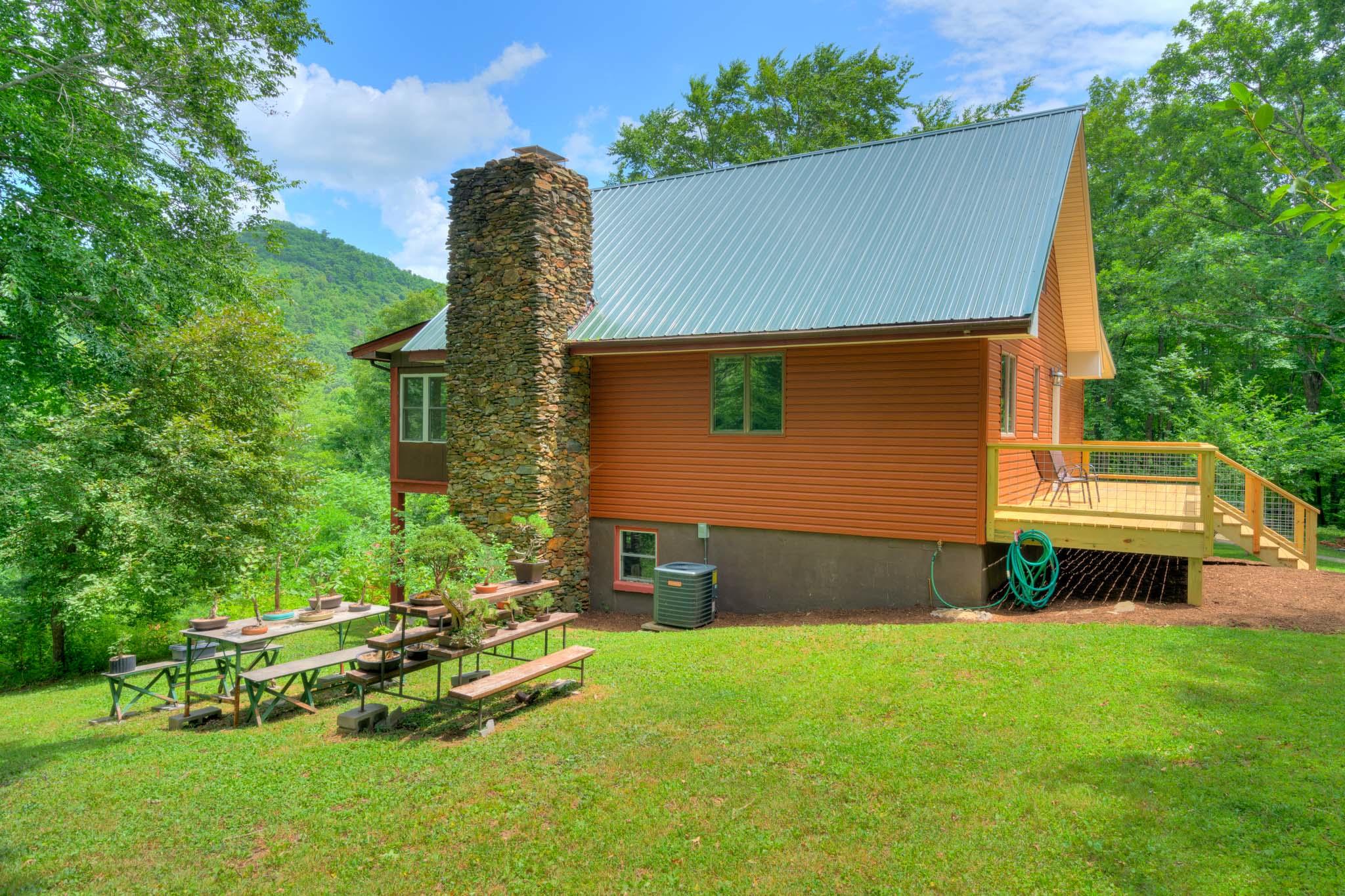 1201 Runnett Bag Road Ferrum, VA 24088 - Photo 14 of 49 a backyard of a house with table and chairs
