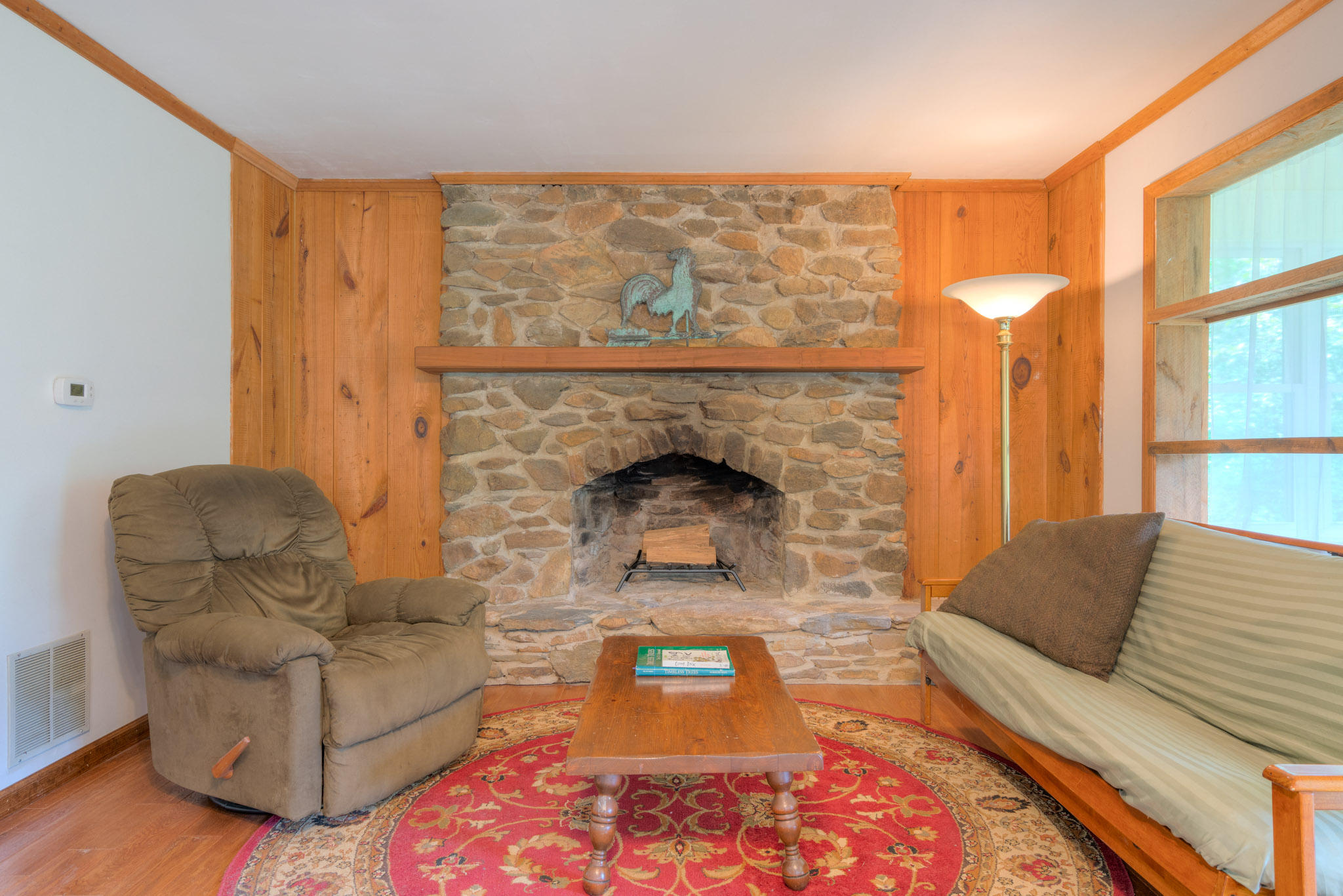 1201 Runnett Bag Road Ferrum, VA 24088 - Photo 24 of 49 a living room with furniture and a fireplace