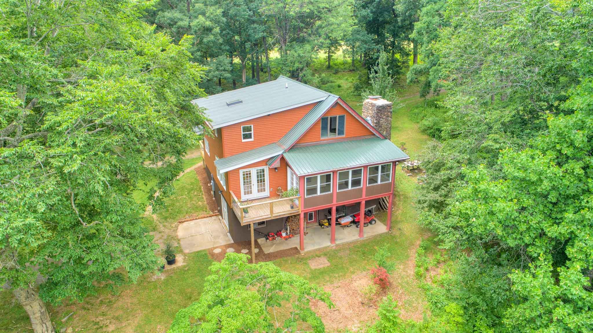 1201 Runnett Bag Road Ferrum, VA 24088 - Photo 44 of 49 an aerial view of a house with balcony and trees al around