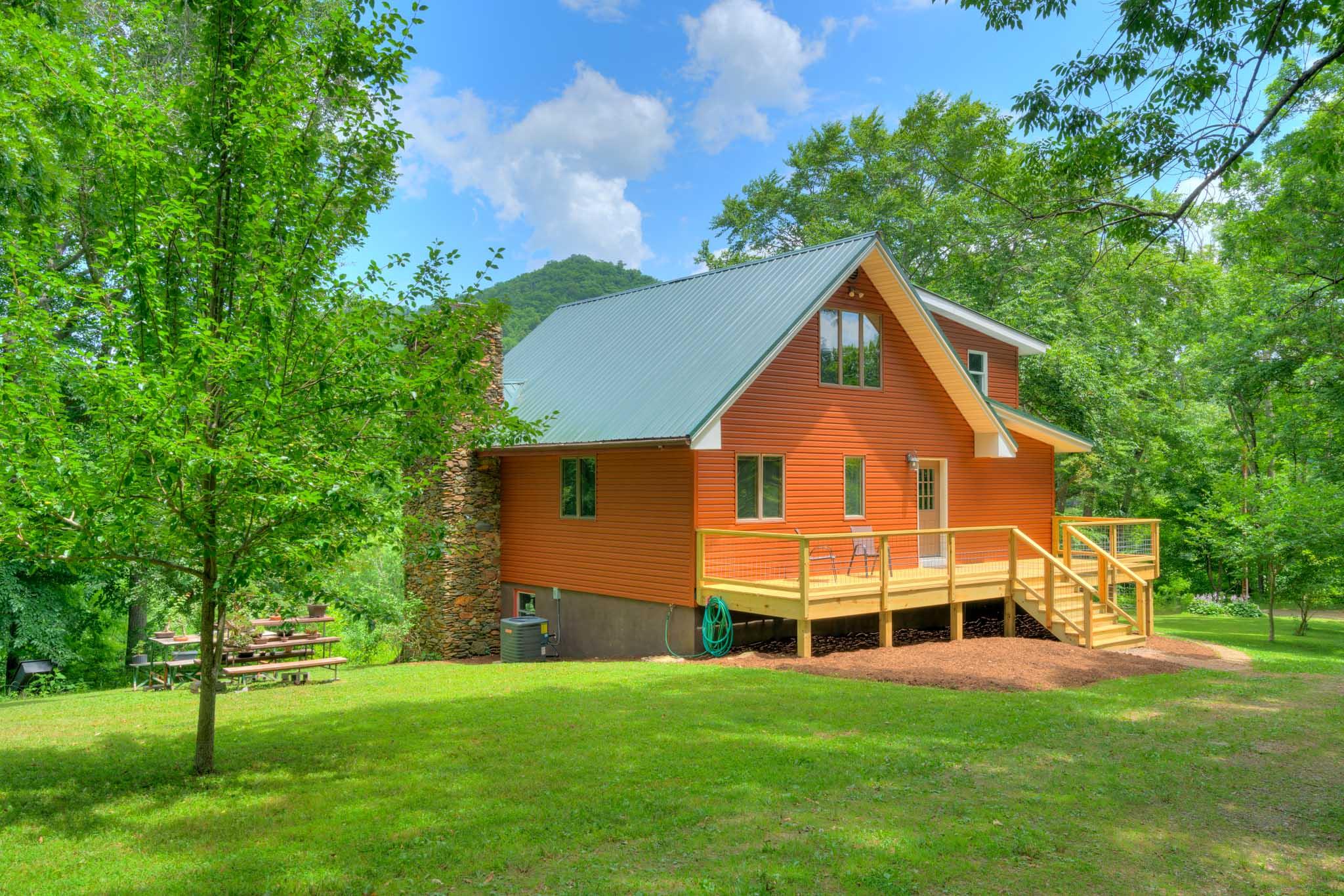1201 Runnett Bag Road Ferrum, VA 24088 - Photo 6 of 49 a front view of a house with a yard