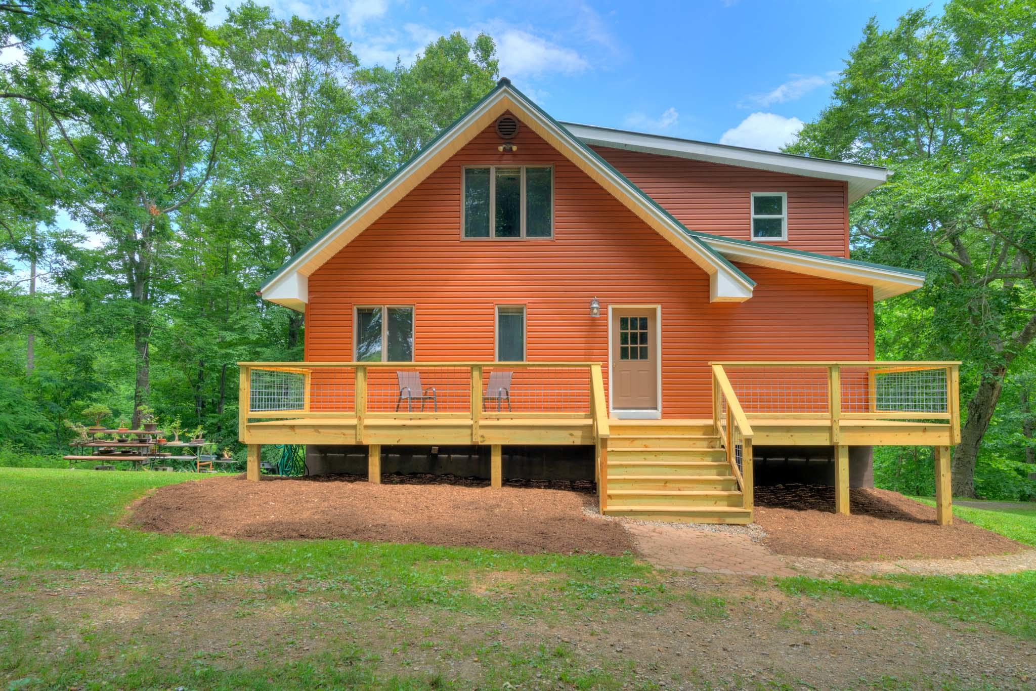 1201 Runnett Bag Road Ferrum, VA 24088 - Photo 7 of 49 a front view of a house with a yard and trees