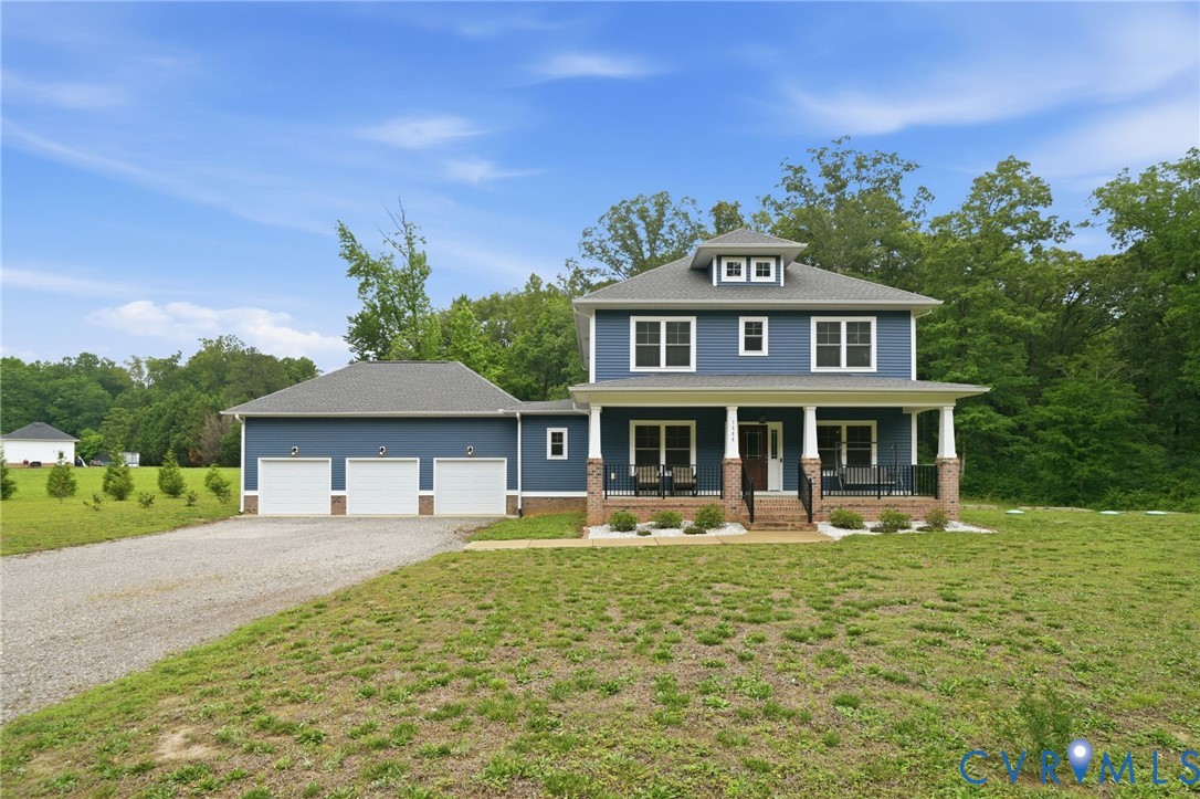 7598 Rural Point Road Mechanicsville, VA 23116 - Photo 1 of 41 a front view of a house with garden