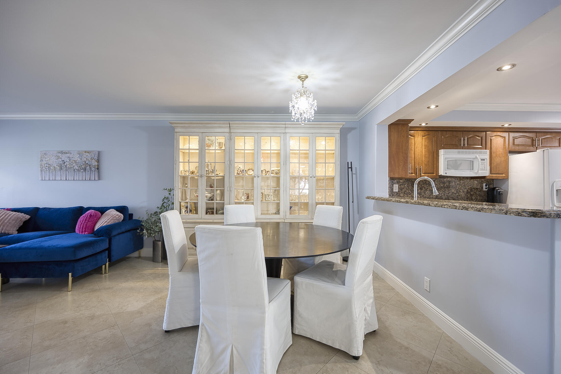 380 Northwest 67th Street, Unit 101 Boca Raton, FL 33487 - Photo 12 of 44 a dining room with furniture and a large window