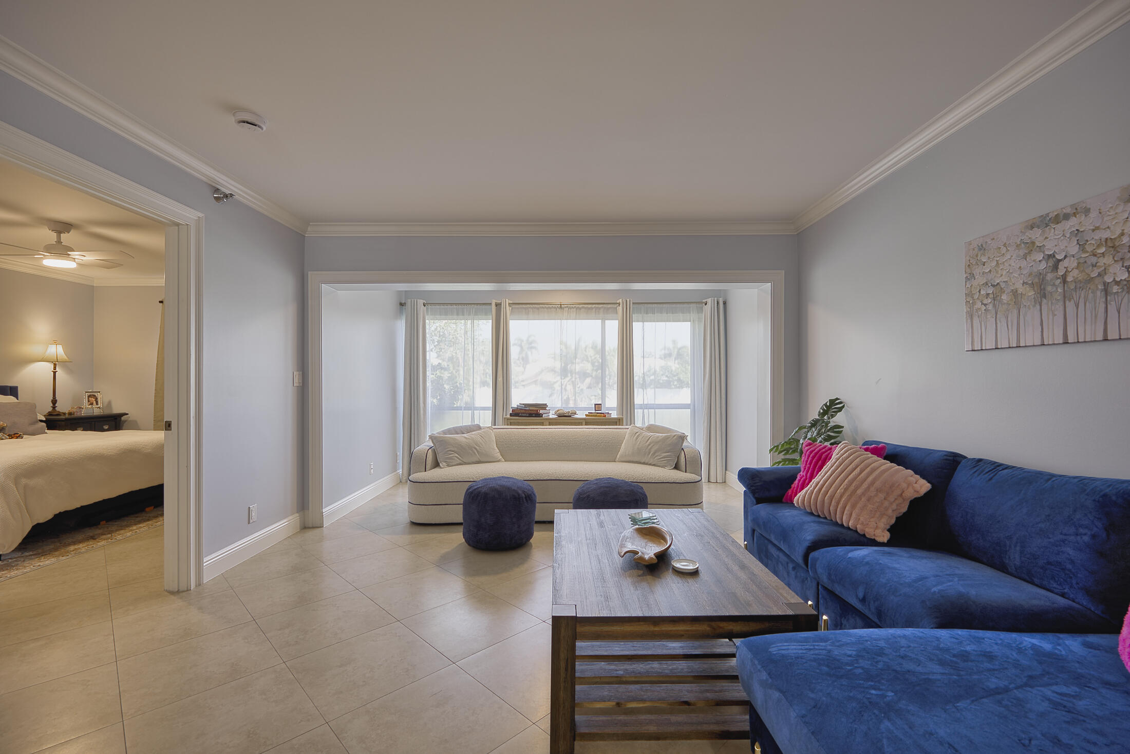 380 Northwest 67th Street, Unit 101 Boca Raton, FL 33487 - Photo 13 of 44 a living room with furniture and a large window