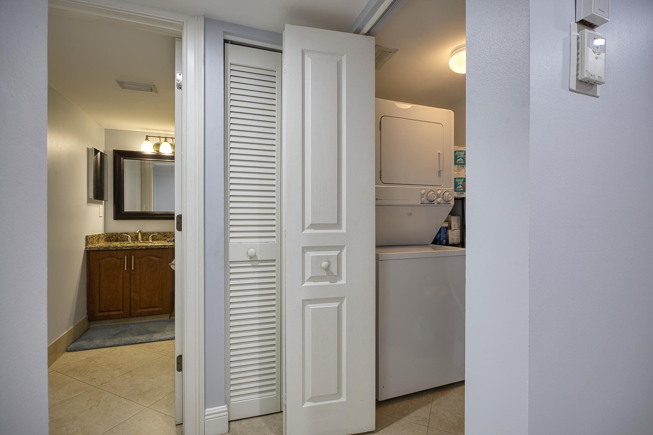 380 Northwest 67th Street, Unit 101 Boca Raton, FL 33487 - Photo 30 of 44 a view of hallway with cabinets and wooden floor