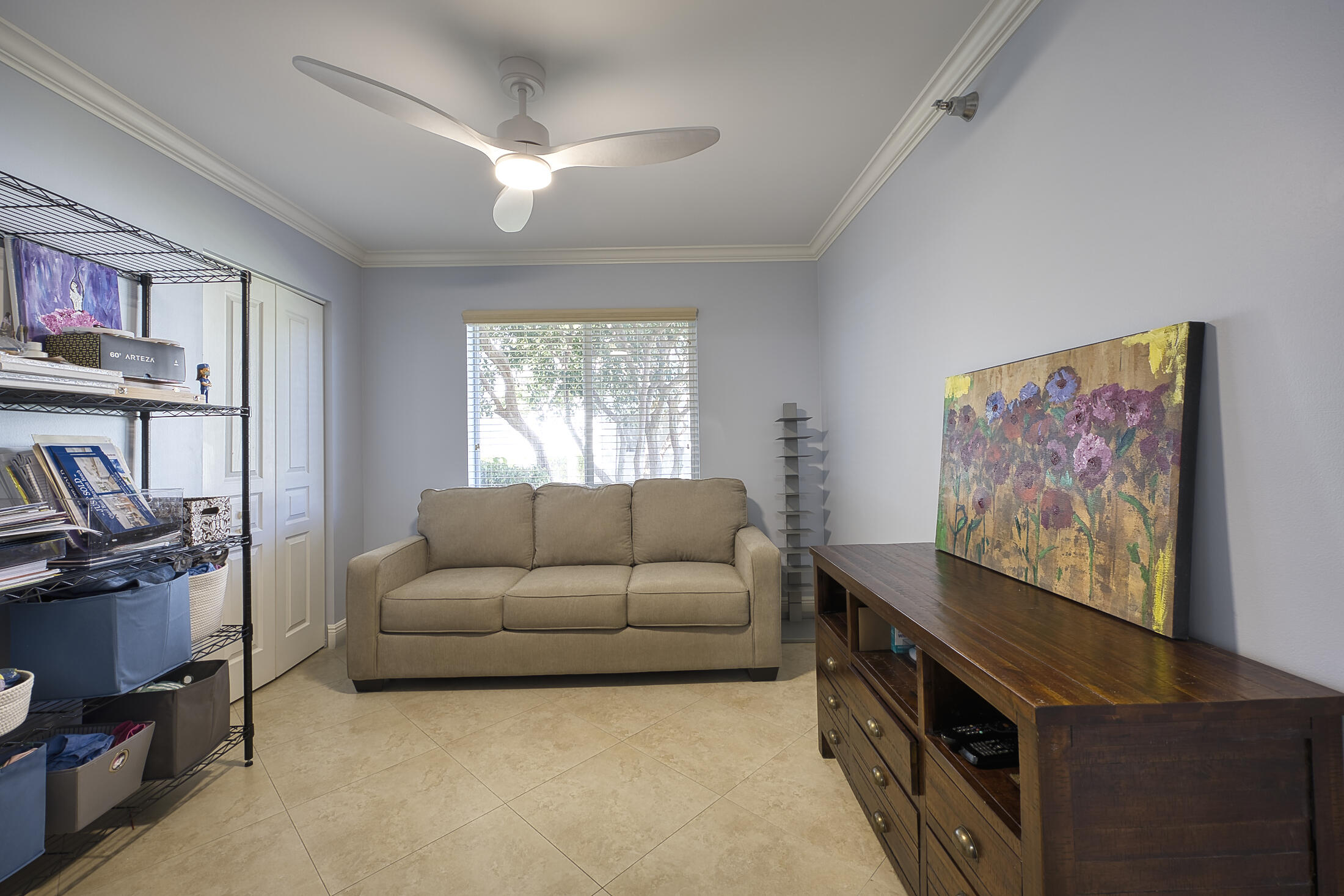 380 Northwest 67th Street, Unit 101 Boca Raton, FL 33487 - Photo 32 of 44 a living room with furniture and a flat screen tv