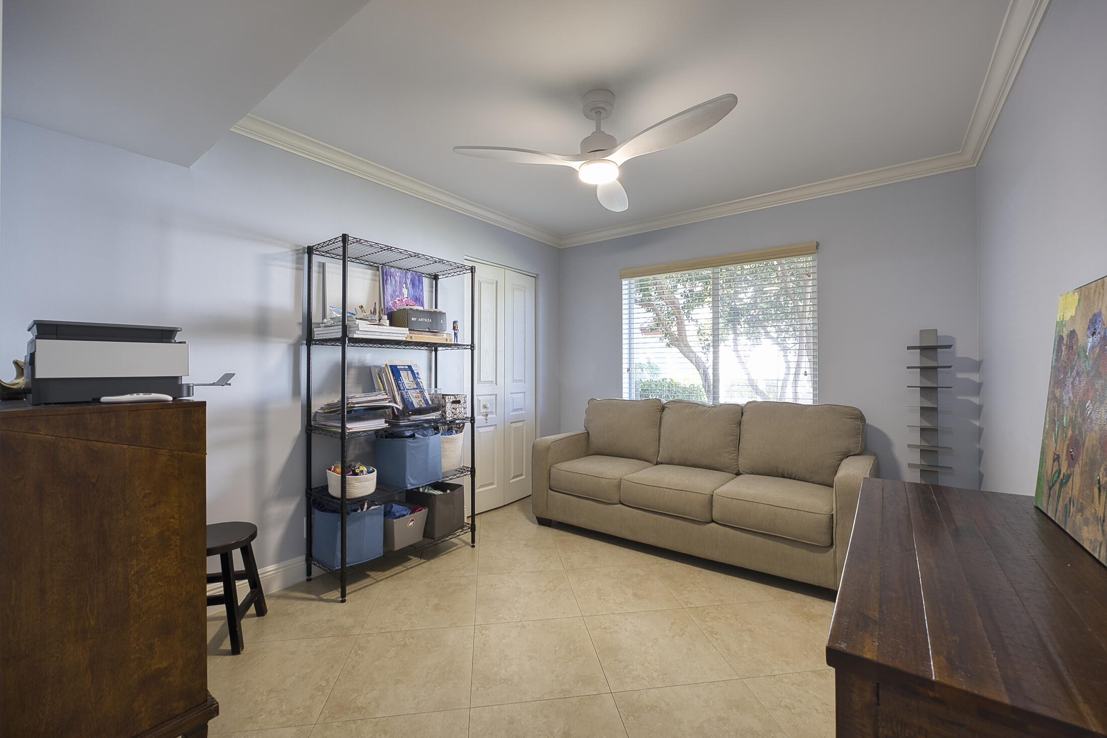 380 Northwest 67th Street, Unit 101 Boca Raton, FL 33487 - Photo 33 of 44 a living room with furniture and a window