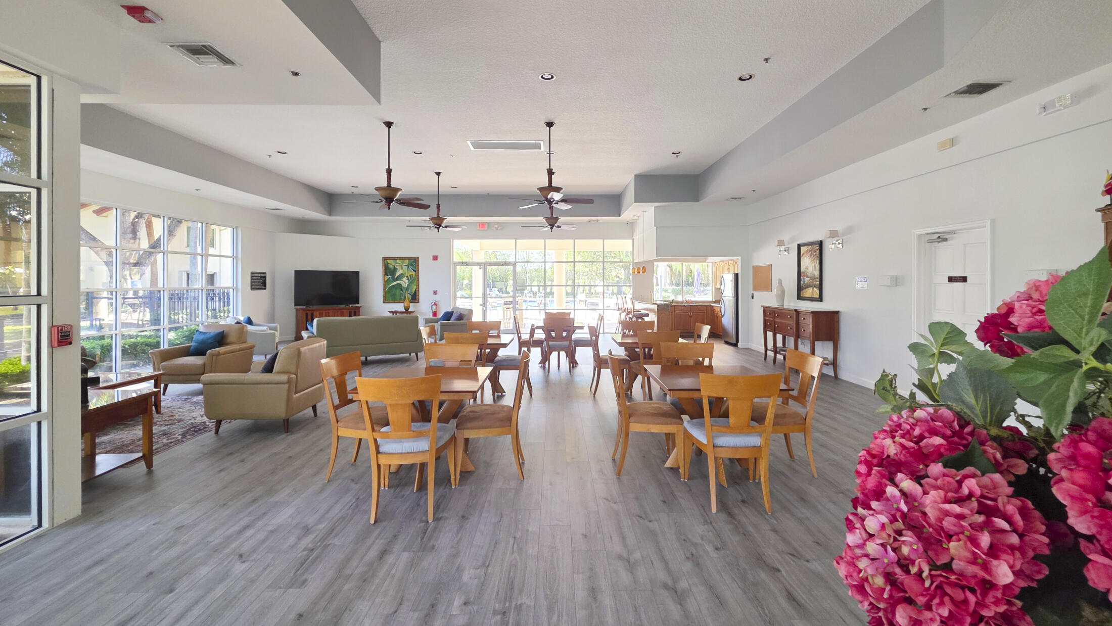 380 Northwest 67th Street, Unit 101 Boca Raton, FL 33487 - Photo 35 of 44 a room with lots of furniture and wooden floor