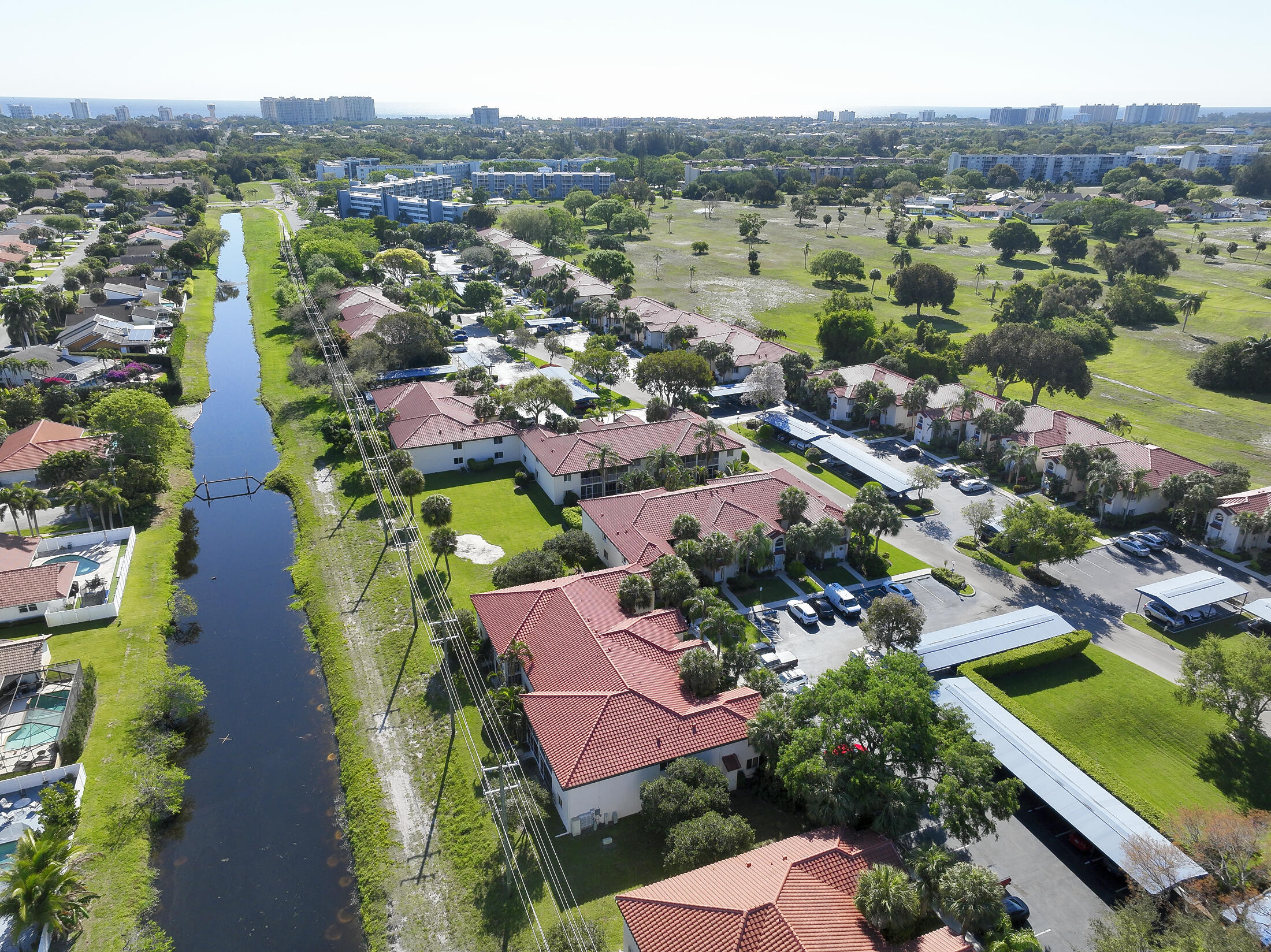 380 Northwest 67th Street, Unit 101 Boca Raton, FL 33487 - Photo 41 of 44 an aerial view of residential houses with outdoor space and river