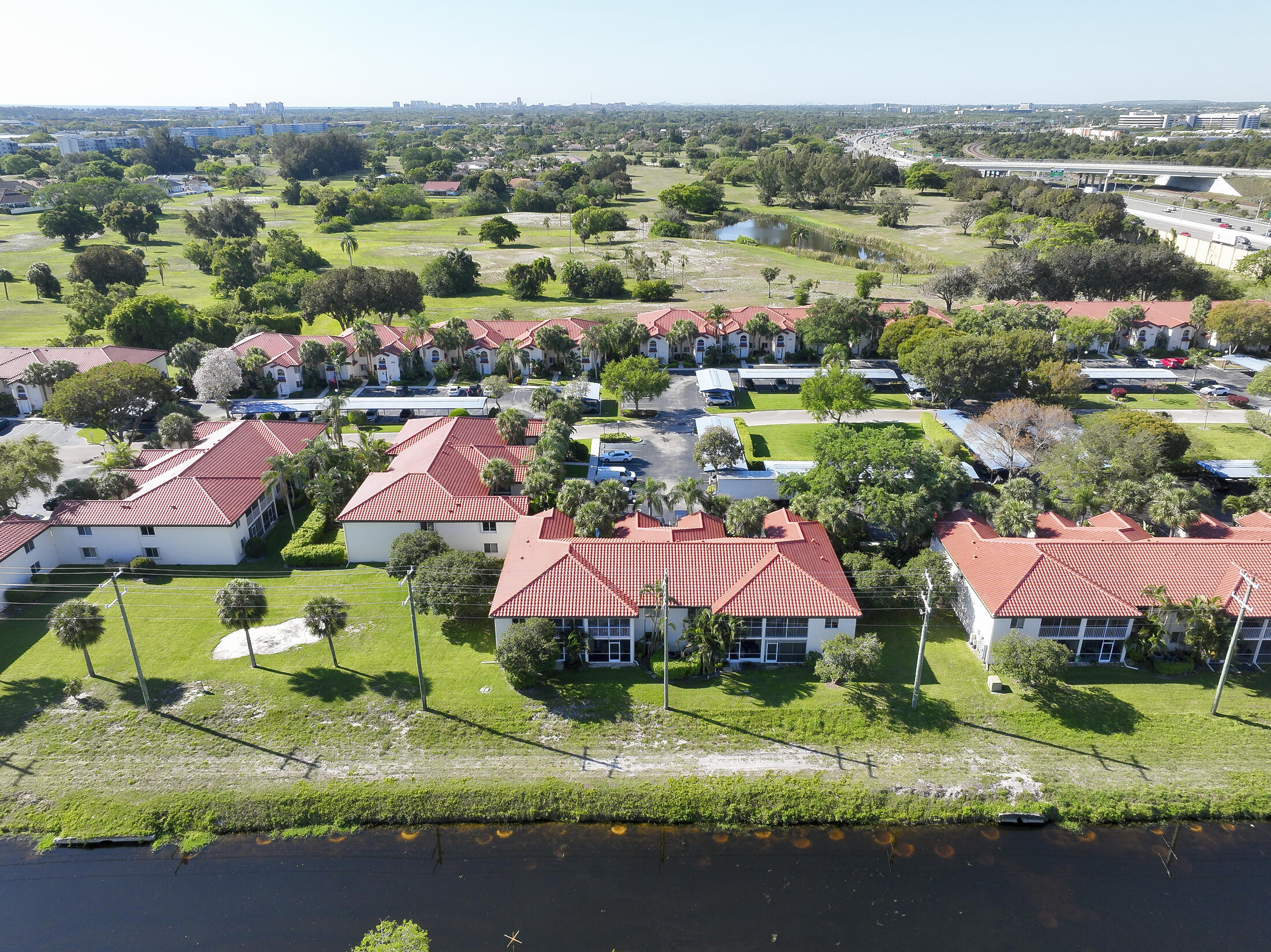 380 Northwest 67th Street, Unit 101 Boca Raton, FL 33487 - Photo 42 of 44 an aerial view of residential houses and outdoor space