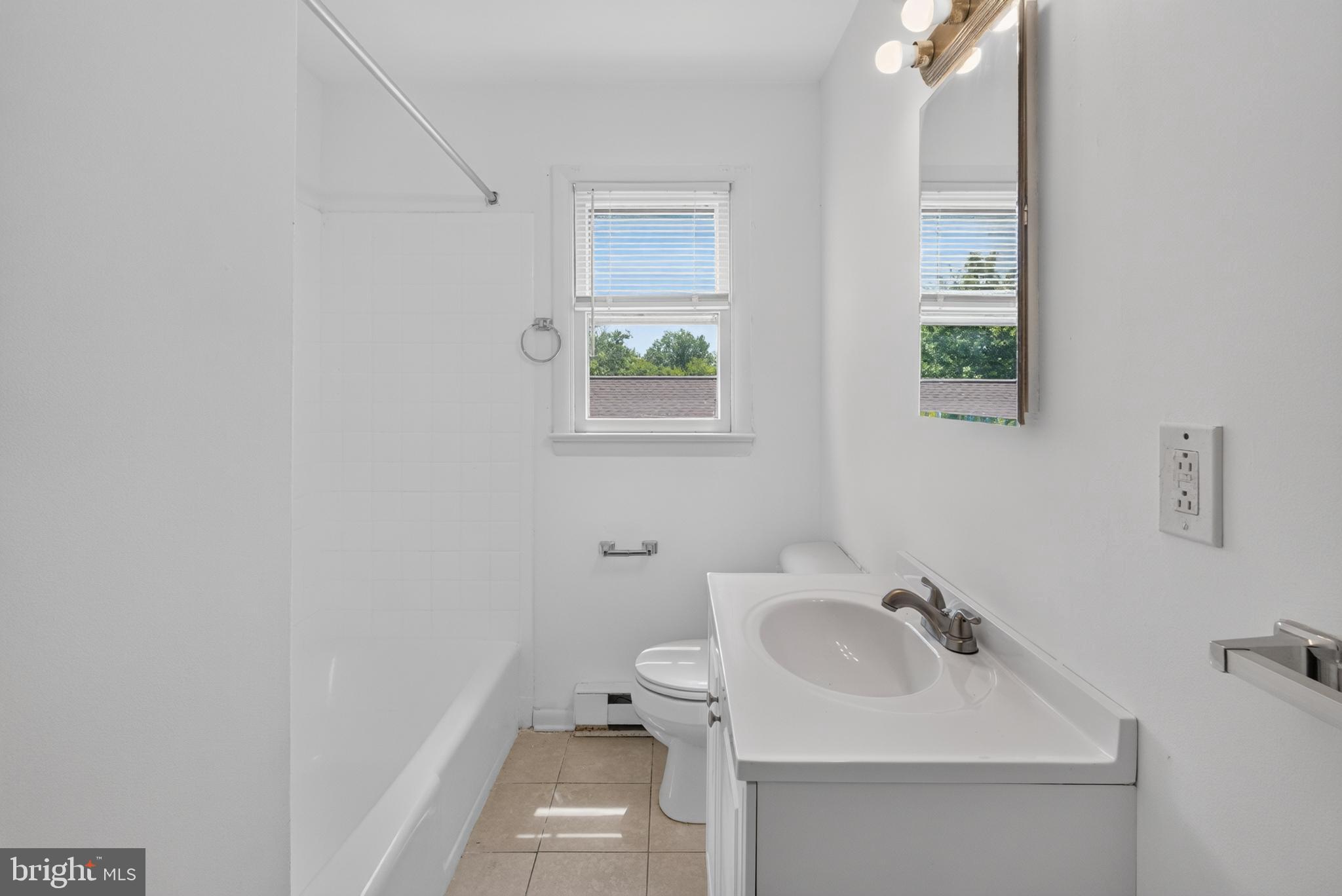 351 Calvert Street Chestertown, MD 21620 - Photo 16 of 19 a bathroom with a sink and a toilet