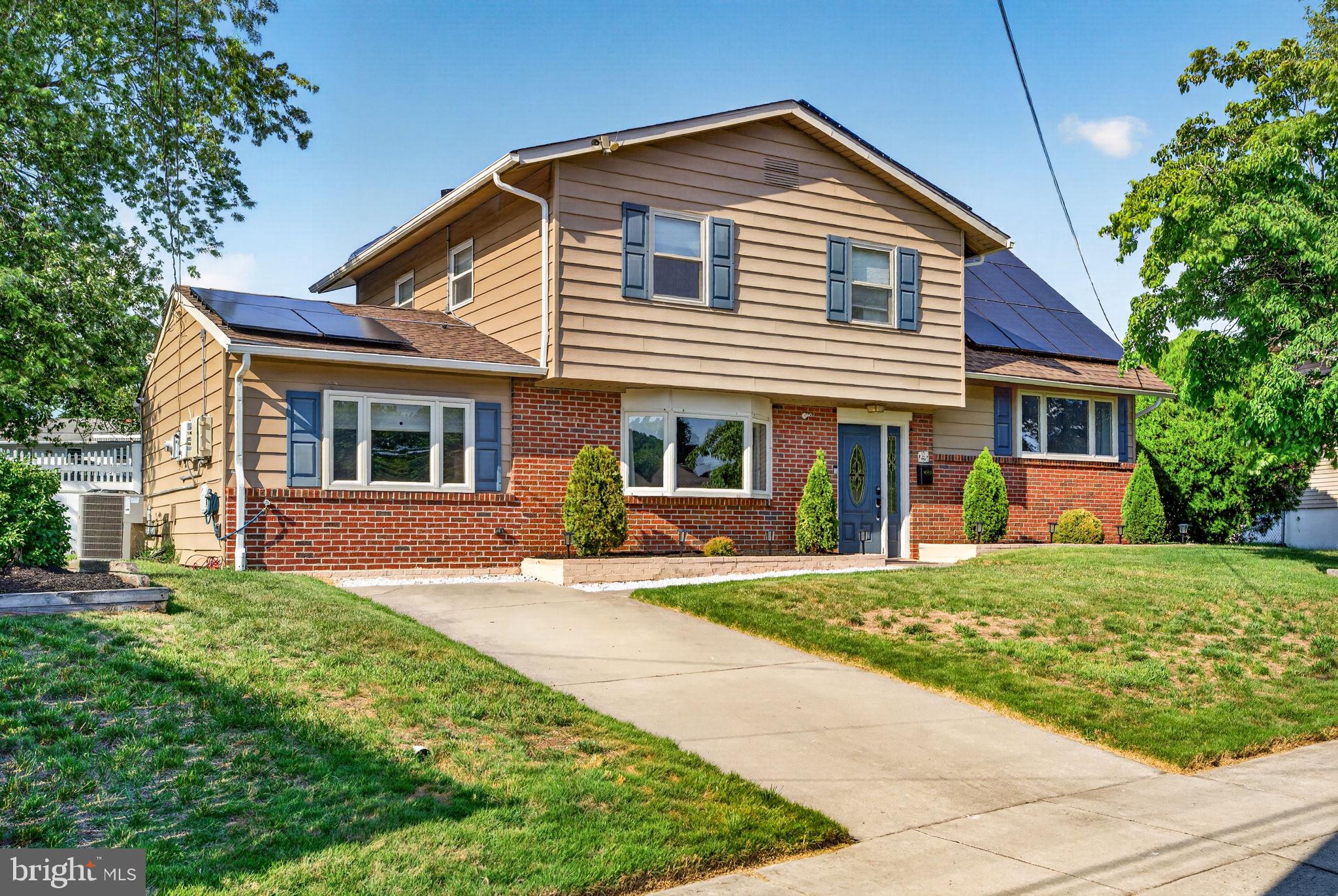 12 Woodbridge Road Gibbsboro, NJ 08026 - Photo 2 of 45 a front view of a house with a garden