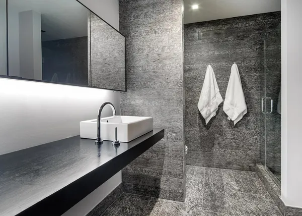 a bathroom with a sink and mirror