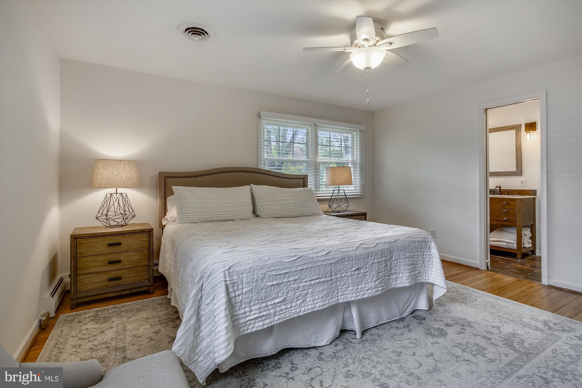 1437 Cola Drive McLean, VA 22101 - Photo 12 of 34 a bedroom with bed and a chandelier