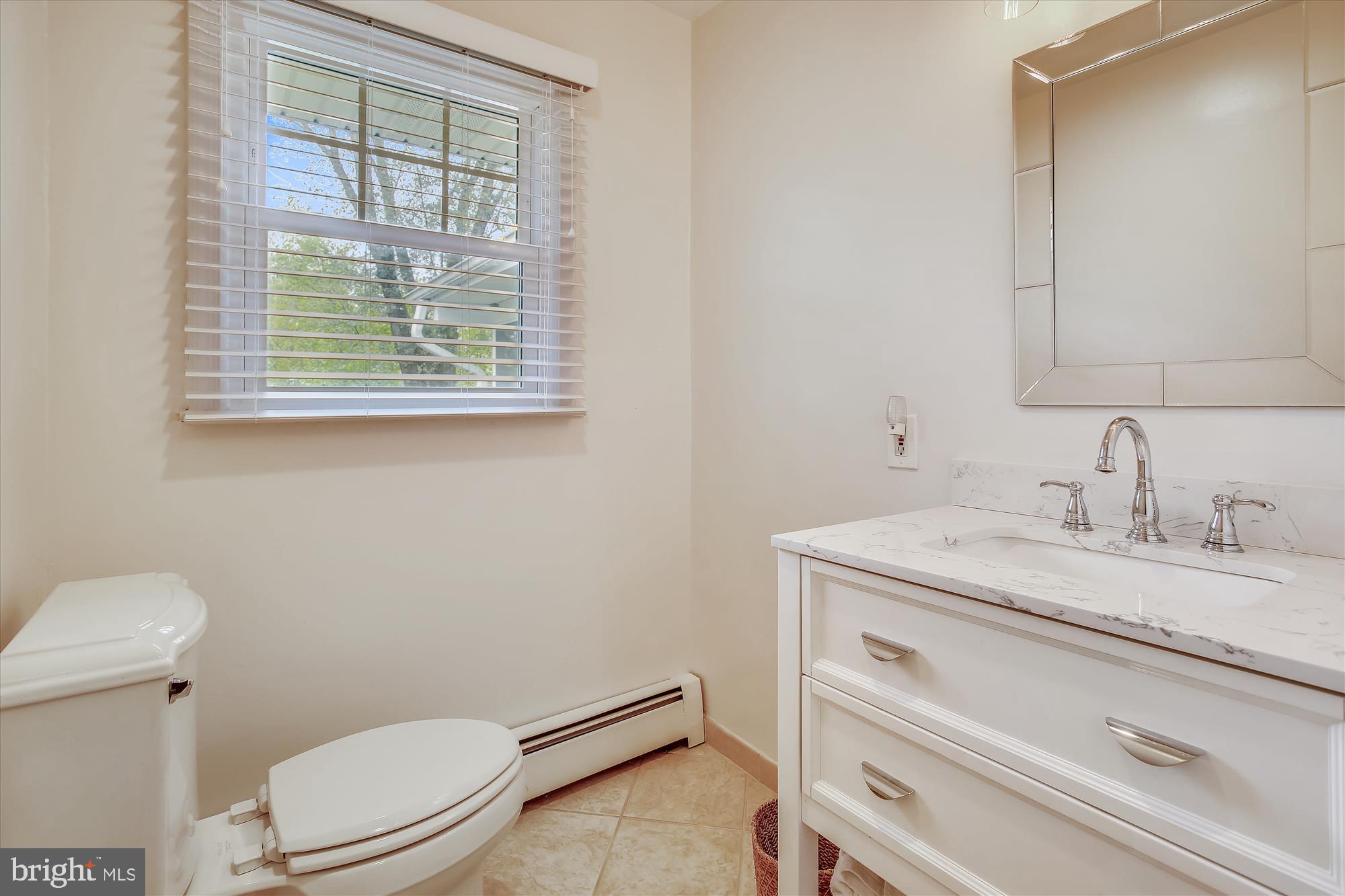 1437 Cola Drive McLean, VA 22101 - Photo 19 of 34 a bathroom with a granite countertop toilet sink and mirror
