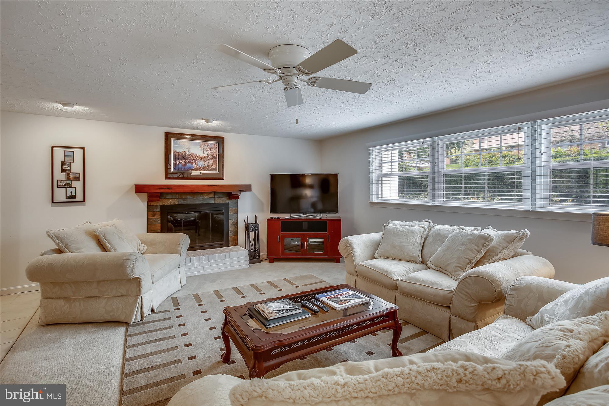 1437 Cola Drive McLean, VA 22101 - Photo 23 of 34 a living room with furniture a flat screen tv and a fireplace