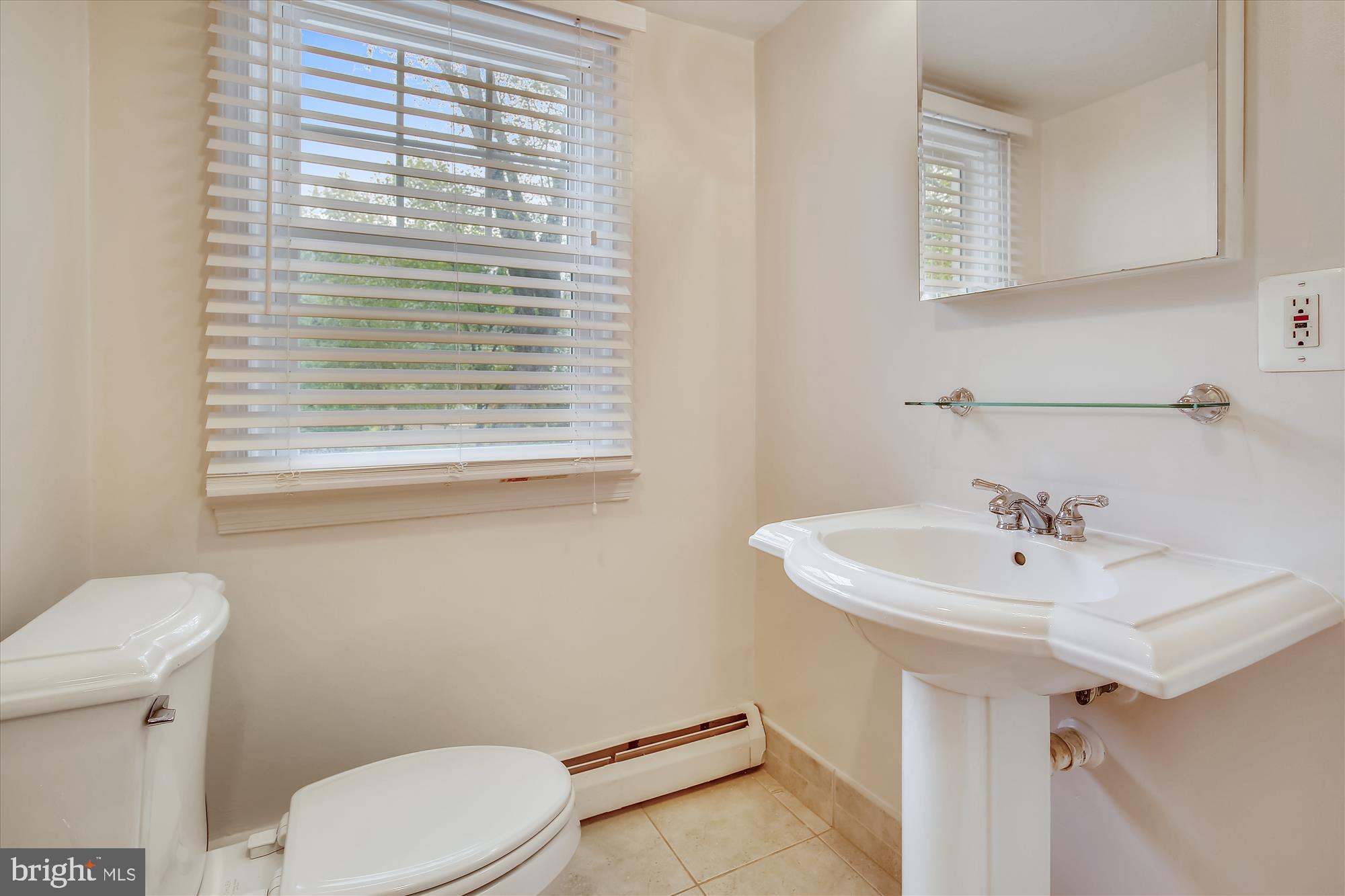 1437 Cola Drive McLean, VA 22101 - Photo 26 of 34 a bathroom with a sink a toilet and a mirror