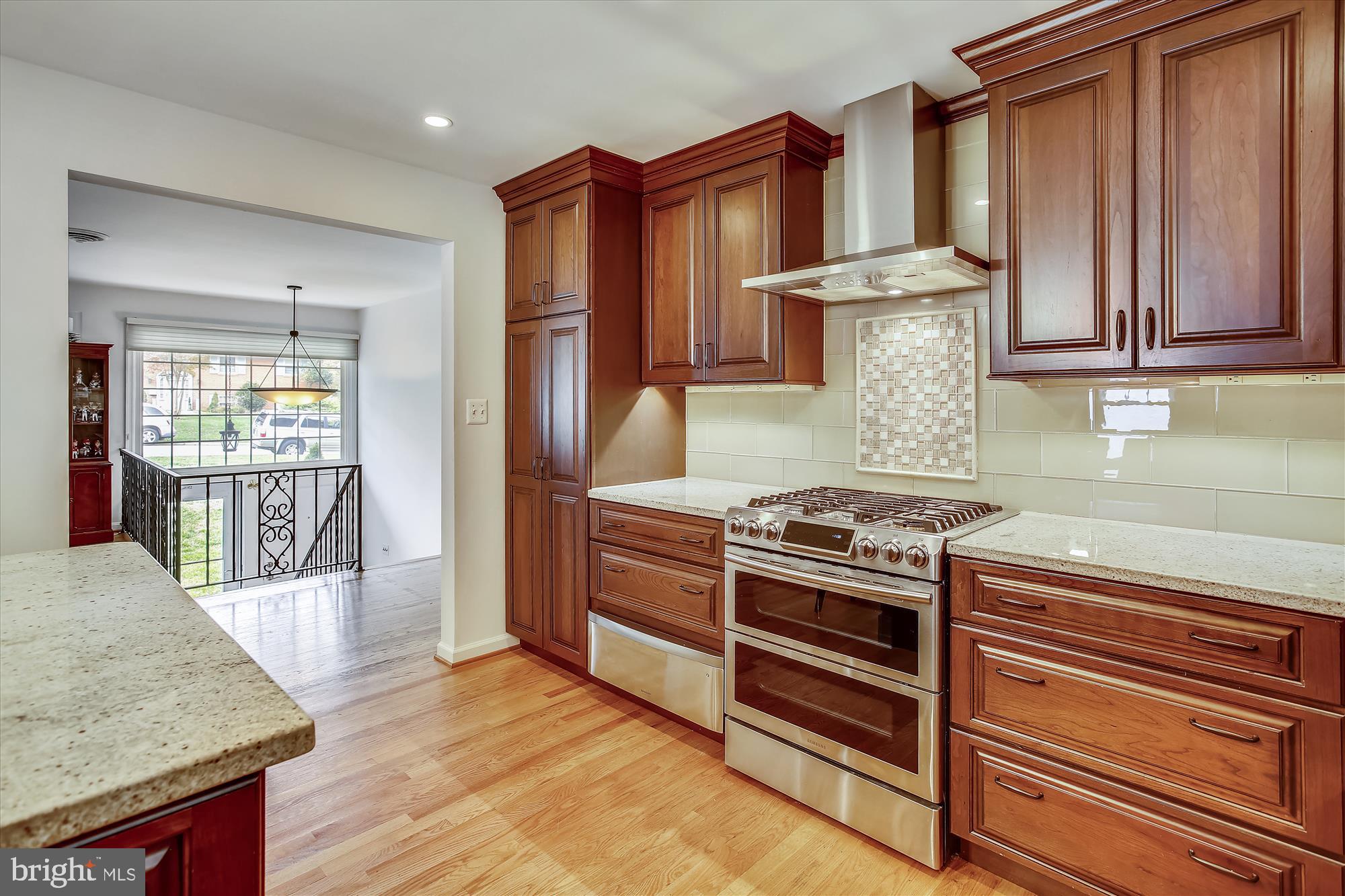1437 Cola Drive McLean, VA 22101 - Photo 5 of 34 a kitchen with a stove and a wooden cabinets