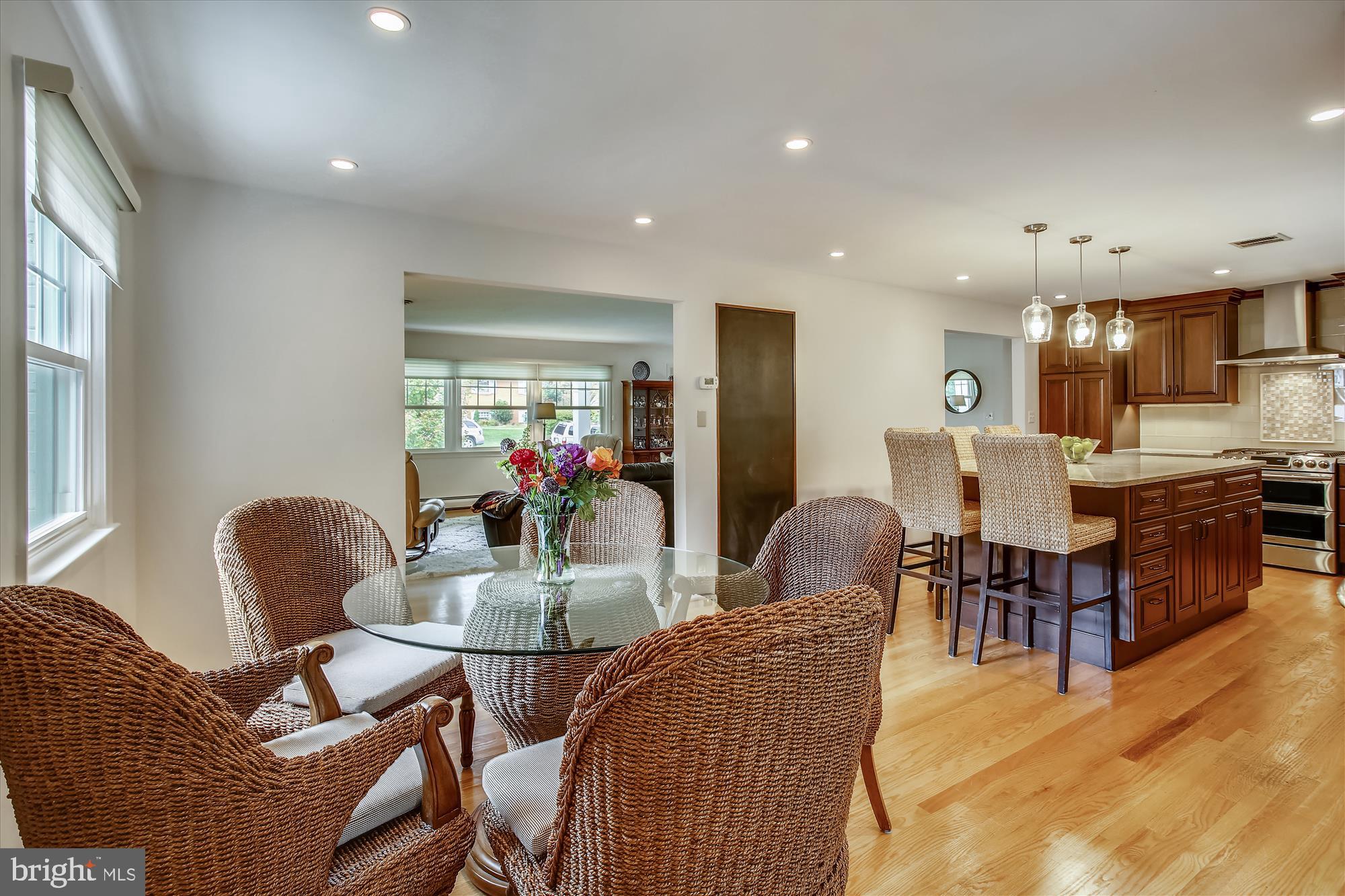 1437 Cola Drive McLean, VA 22101 - Photo 7 of 34 a dining room with furniture and a chandelier
